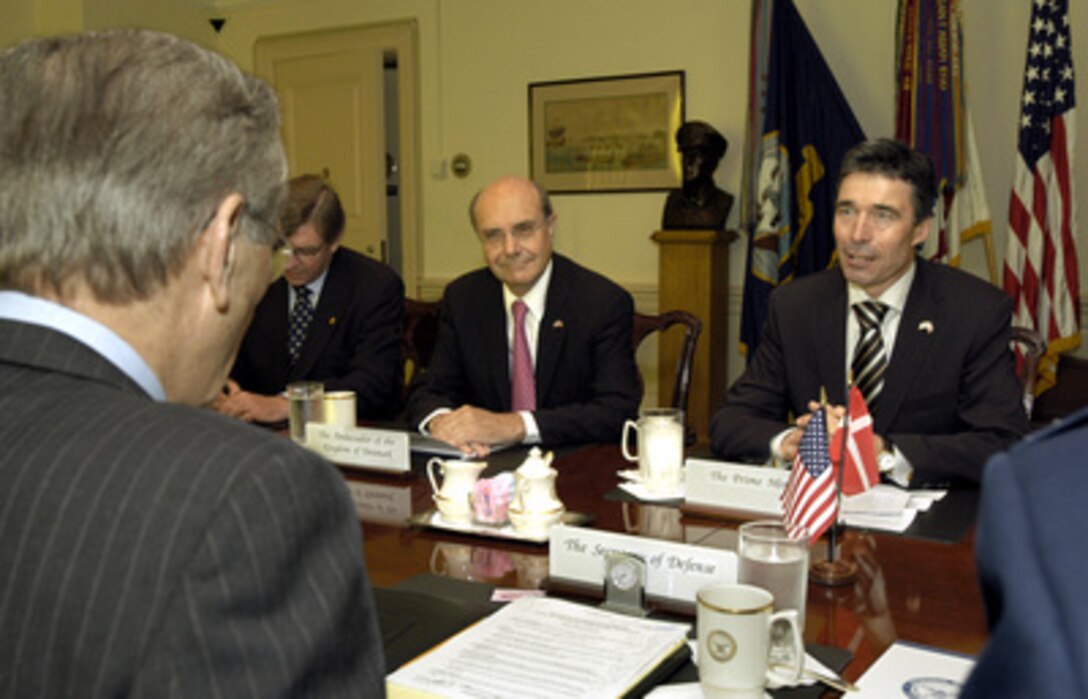 Danish Prime Minister Anders Fogh Rasmussen (right) meets with Secretary of Defense Donald H. Rumsfeld (foreground) in the Pentagon on May 8, 2003. Rasmussen is meeting with Rumsfeld and his senior advisors to discuss a range of bilateral security issues and to review the progress of rebuilding and stabilizing Iraq. Danish Assistant Secretary of State Per Poulsen-Hansen (center) and Ambassador to the United States Ulrik Federspiel (left) also participating in the talks.