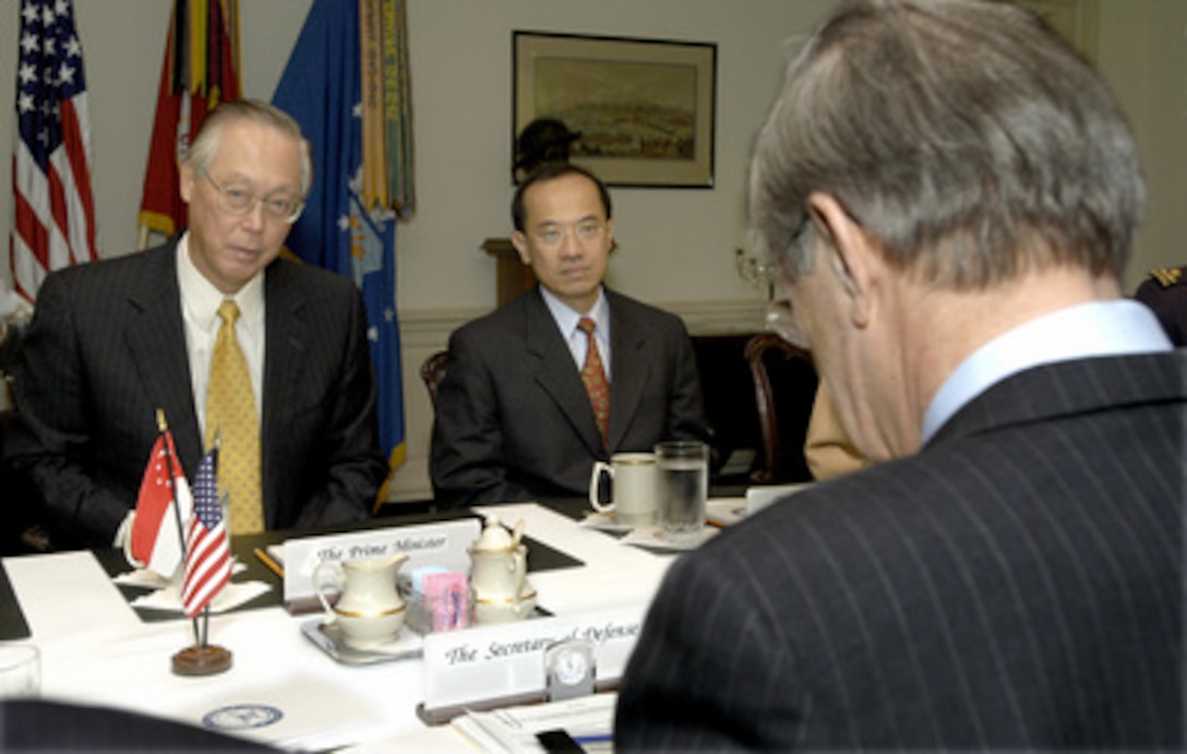 Singapore's Prime Minister Chok Tong Goh (left) meets with Secretary of Defense Donald H. Rumsfeld (foreground) in the Pentagon on May 8, 2003. Goh and Rumsfeld are meeting to discuss a range of bilateral security issues including the continuing war on terrorism. Singapore's Minister for Trade and Industry George Yong-Boon Yeo (center) joined Goh and Rumsfeld in the talks. 