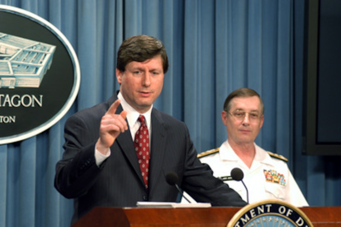 Under Secretary of Defense for Intelligence Stephen A. Cambone briefs reporters in the Pentagon on May 7, 2003, how mobile exploitation teams are identifying, assessing and eliminating Iraq's weapons of mass destruction programs and delivery systems. Cambone, joined by Defense Intelligence Agency Director Vice Adm. Lowell E. Jacoby, U.S. Navy, told reporters about the recovery of a suspected mobile biological weapons facility that was recovered by U.S. Forces in northern Iraq in late April. The trailer resembles one of the mobile laboratories described by Secretary of State Colin Powell in his remarks to the United Nations Security Council in February. 