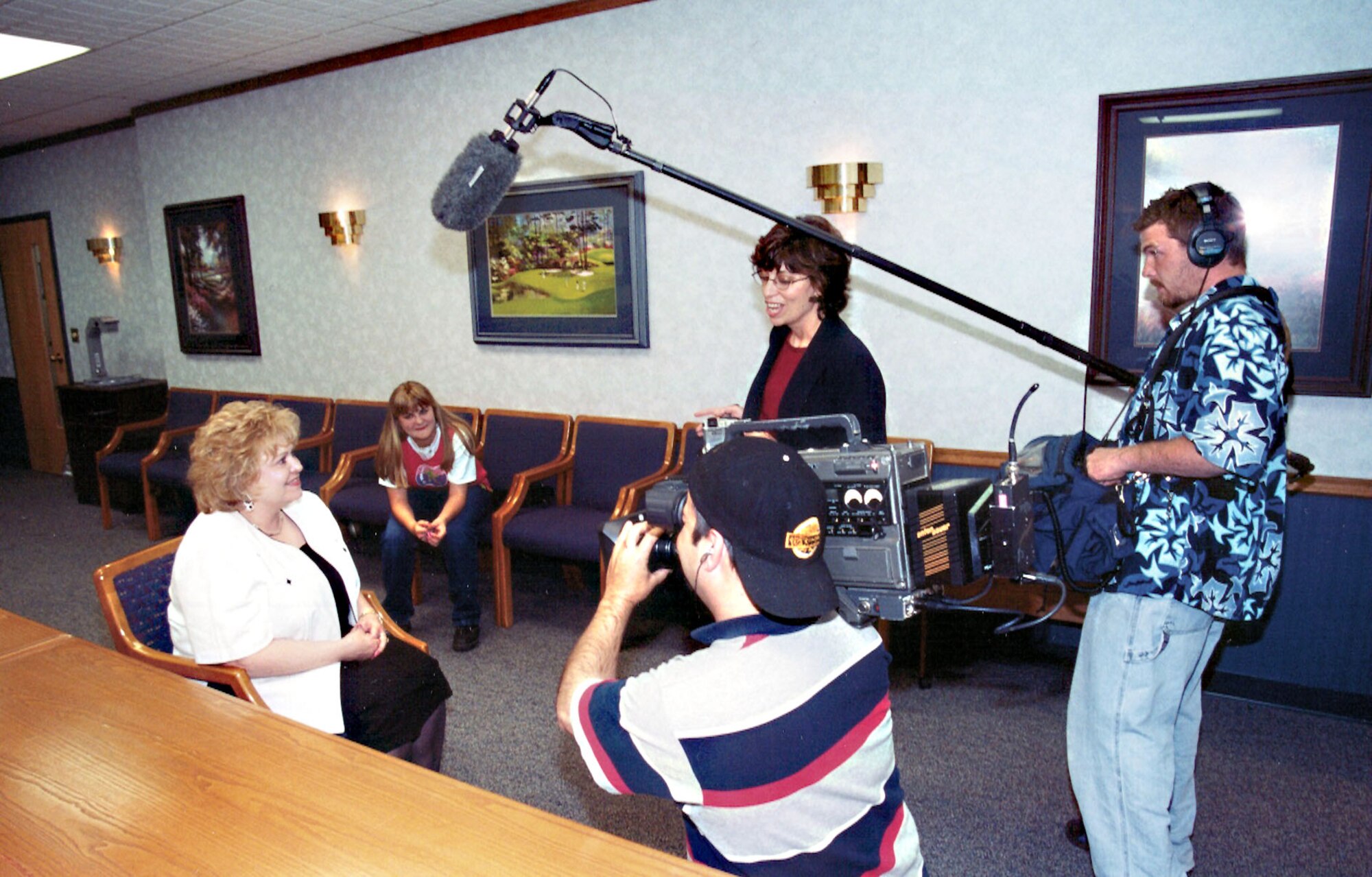 TINKER AIR FORCE BASE, Okla. -- Marilyn Petricek and her daughter, Savanna, watch a videotaped message from Oprah Winfrey before going to Chicago to be on "The Oprah Winfrey show" on May 9.  The two were invited to be guests on a Mother's Day-themed show after Savanna wrote a letter about how her foster mother, "her angel," adopted her.  (U.S. Air Force photo by Eddie Edge)