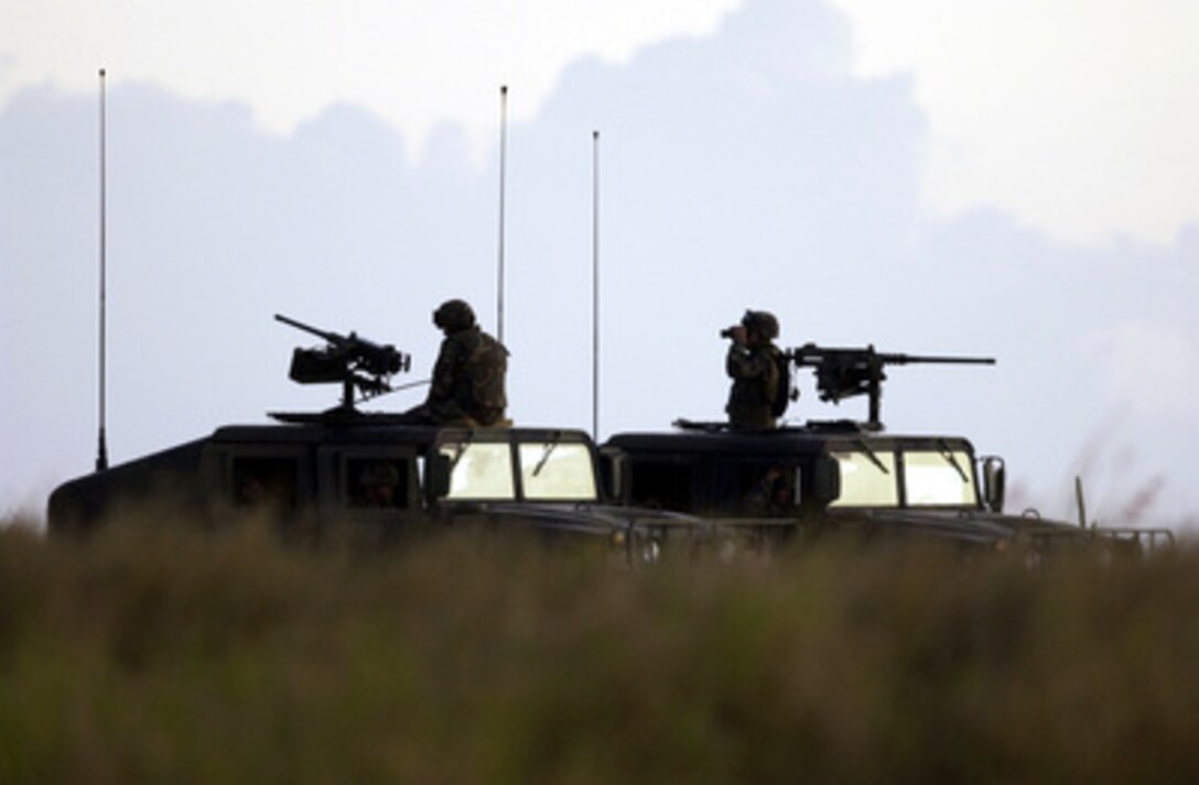 Soldiers from the Army's 116th Infantry Regiment provide airfield security in Guantanamo Bay, Cuba. 