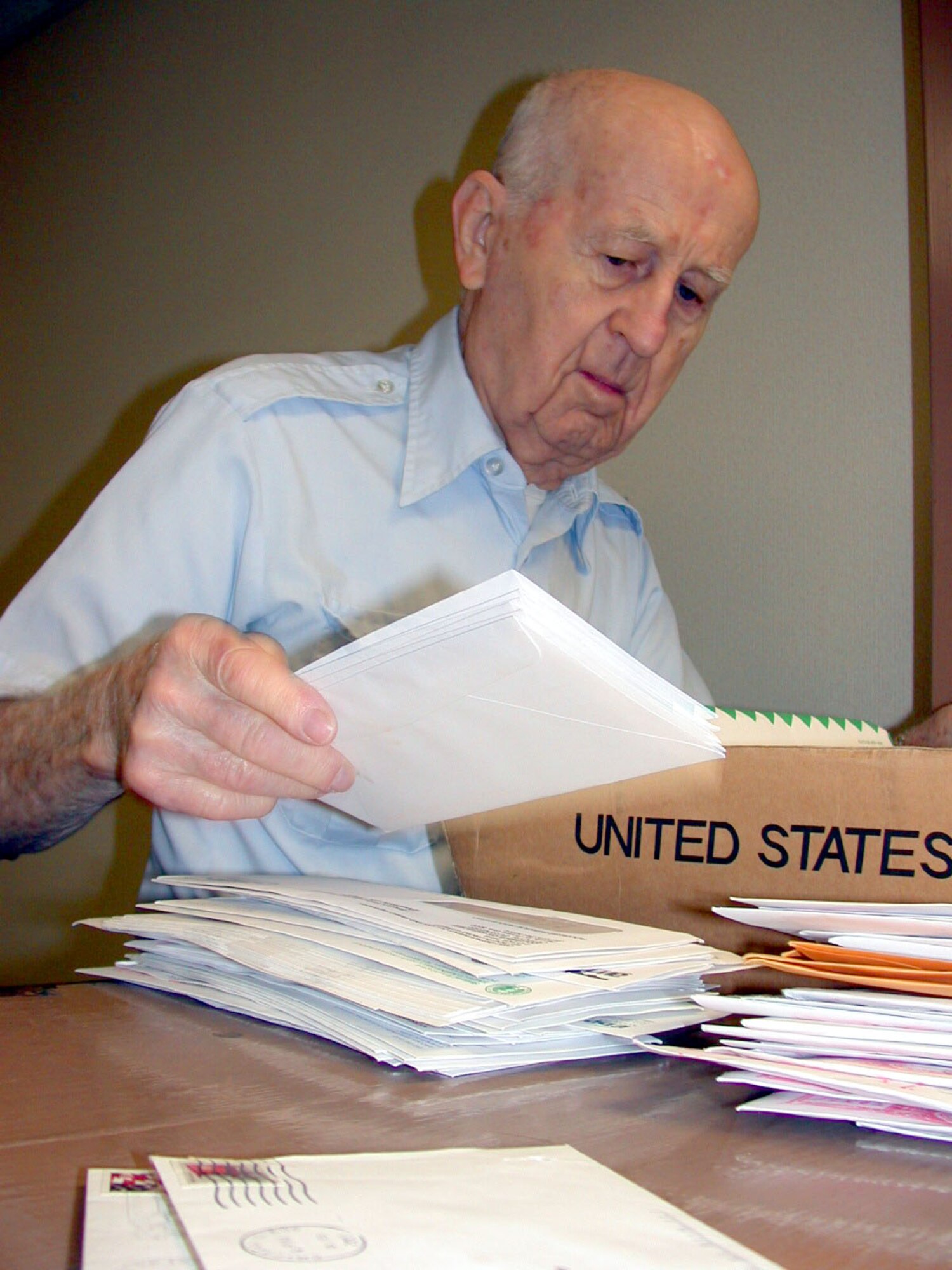 RANDOLPH AIR FORCE BASE, Texas -- Martin "Mike" Mikulski, 90, sorts mail at the Air Force Personnel Center here.  A retired master sergeant and mailman, he has volunteered at the center and base chapel for 24 years.  (U.S. Air Force photo by 1st Lt. Brandon Lingle)