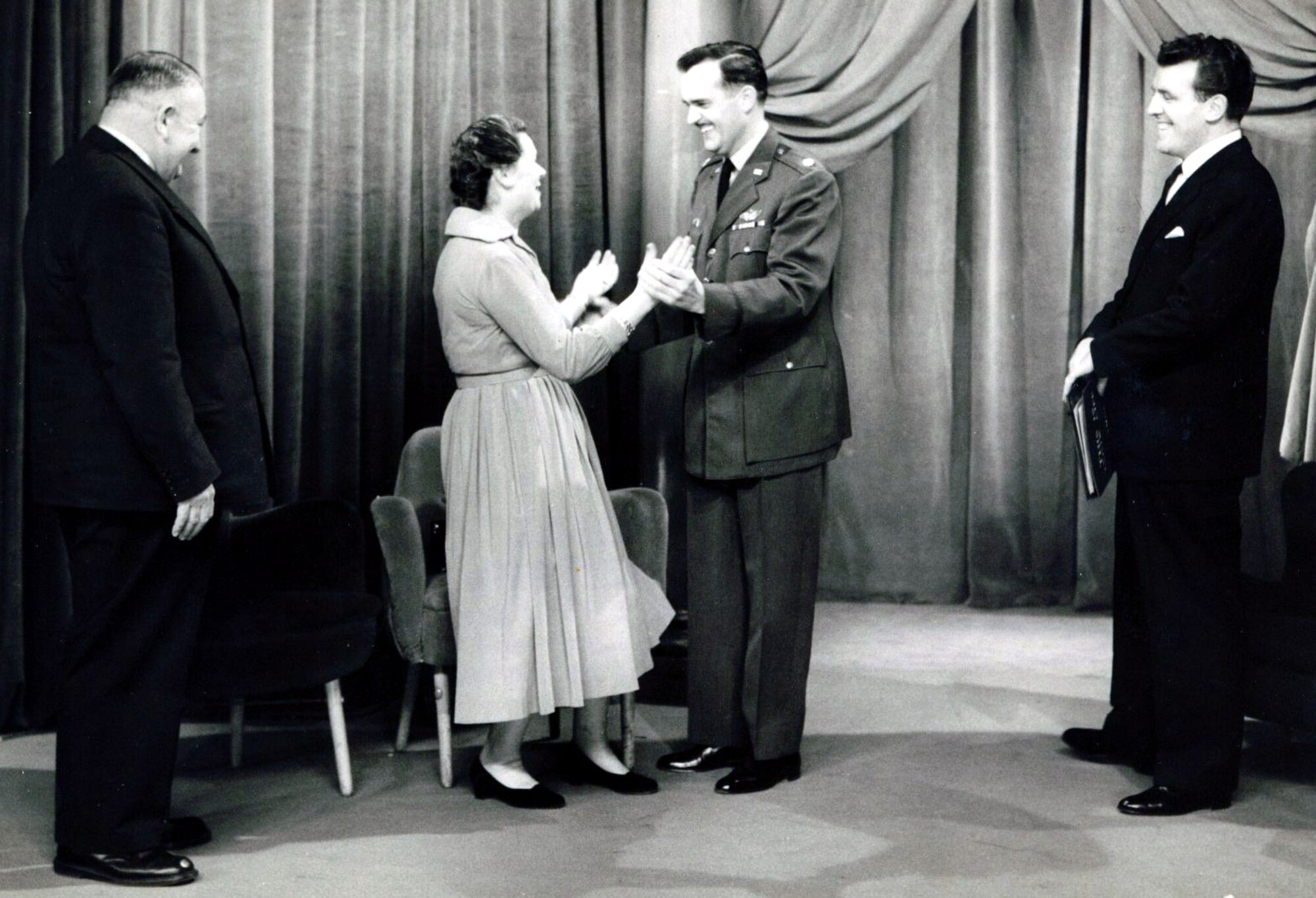 FILE PHOTO -- Julien and Anne Brusselmans (left) were reunited with Maj. Hank Sarnow, a downed airman who stayed with them for a month to avoid capture by the Germans in World War II.  The three appeared on "This Is Your Life" in 1957, which was hosted by Eamon Andrews.  (Courtesy photo)