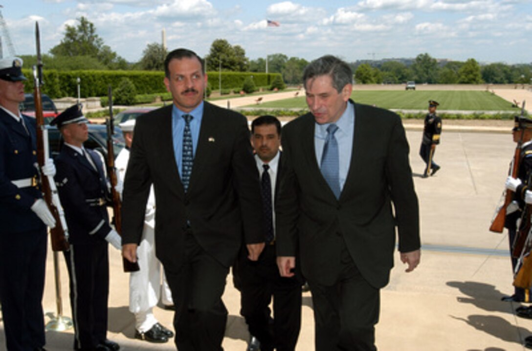 Deputy Secretary of Defense Paul Wolfowitz (right) escorts Jordan's Crown Prince Faisal bin Hussein into the Pentagon on May 14, 2003. The two men will meet to discuss a range of regional security issues of interest to both nations. 
