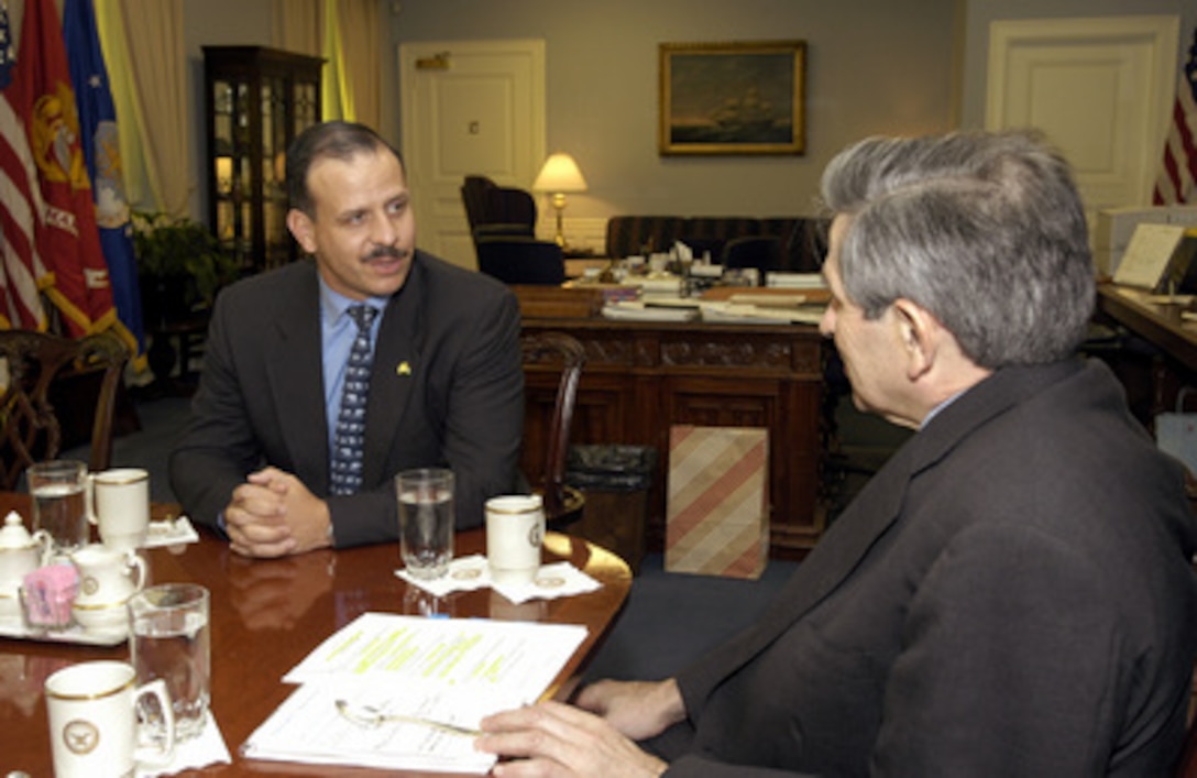 Jordan's Crown Prince Faisal bin Hussein (left) meets with Deputy Secretary of Defense Paul Wolfowitz (right) in the Pentagon on May 14, 2003. The two men are meeting to discuss a broad range of regional security issues of interest to both nations. 