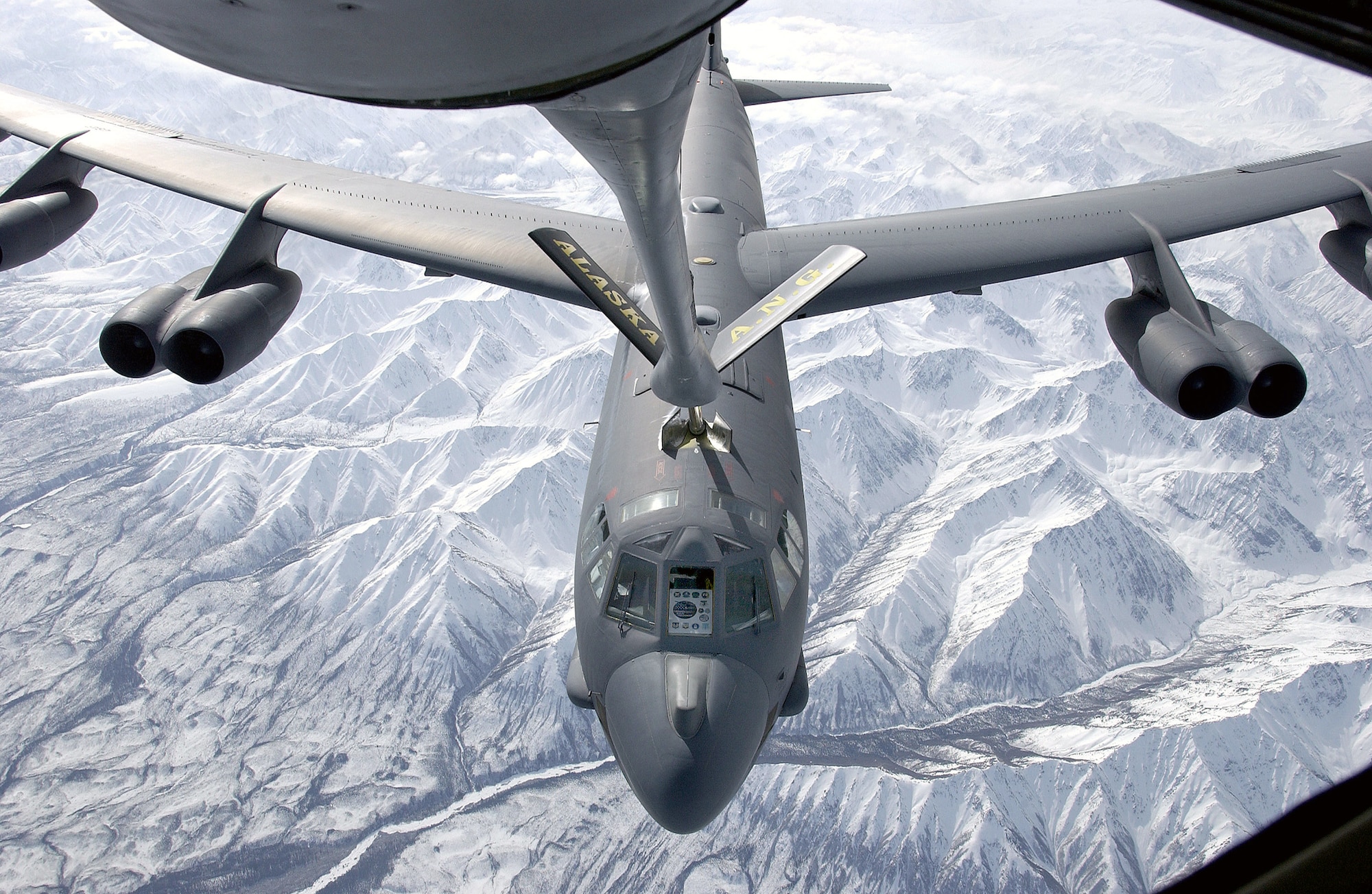 OVER ALASKA (AFPN) -- A B-52H Stratofortress receives fuel over Alaska during a recent mission.  The B-52H Avionics Midlife Improvement project completed two missions to test new hardware and software upgrades.  With the upgrades, B-52s will continue flying until 2040.  (Courtesy photo)