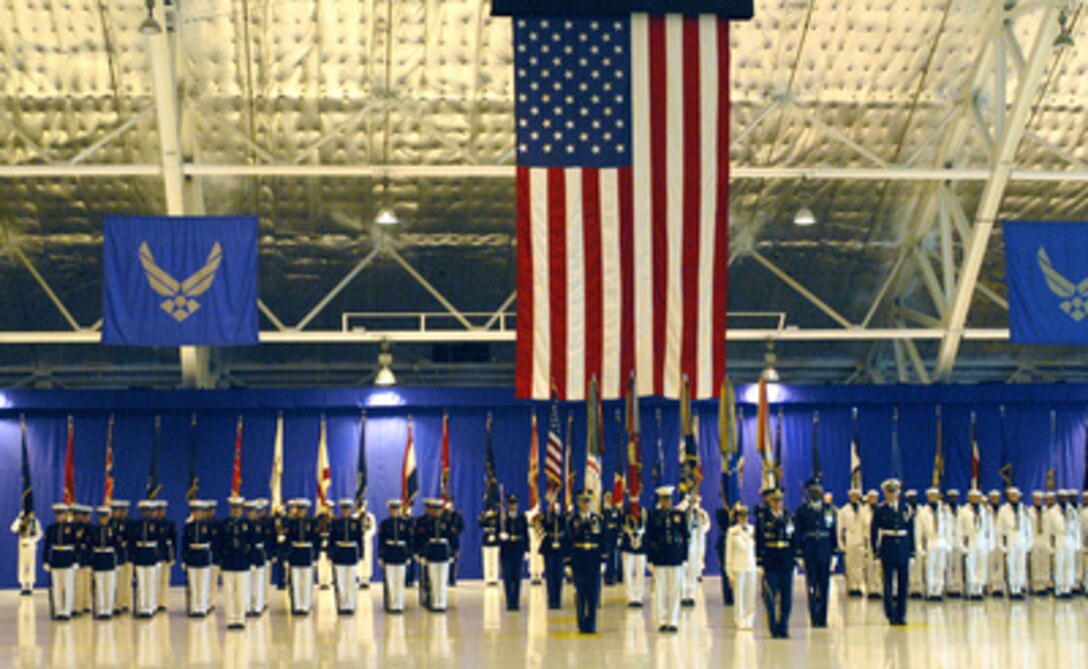 An honor guard representing each of the nation's armed services stands in formation during opening ceremonies of the Joint Armed Forces Open House and Air Show at Andrews Air Force Base, Md., on May 16, 2003. Secretary of Defense Donald H. Rumsfeld and Chairman of the Joint Chiefs of Staff Gen. Richard B. Myers, U.S. Air Force, were on hand to address the audience and greet military families in attendance. The open house affords the public the opportunity to meet some of the men and women serving in our military forces and examine the latest military aircraft, combat vehicles and weapons systems. 