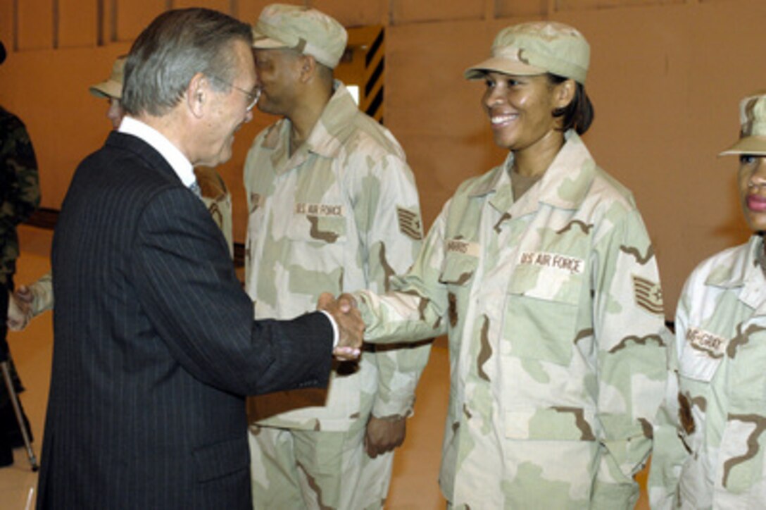 Secretary of Defense Donald H. Rumsfeld greets U.S. Air Force troops that recently returned from service in Operation Iraqi Freedom at the Joint Armed Forces Open House and Air Show at Andrews Air Force Base, Md., on May 16, 2003. The open house affords the public the opportunity to meet some of the men and women serving in our military forces and examine the latest military aircraft, combat vehicles and weapons systems. 