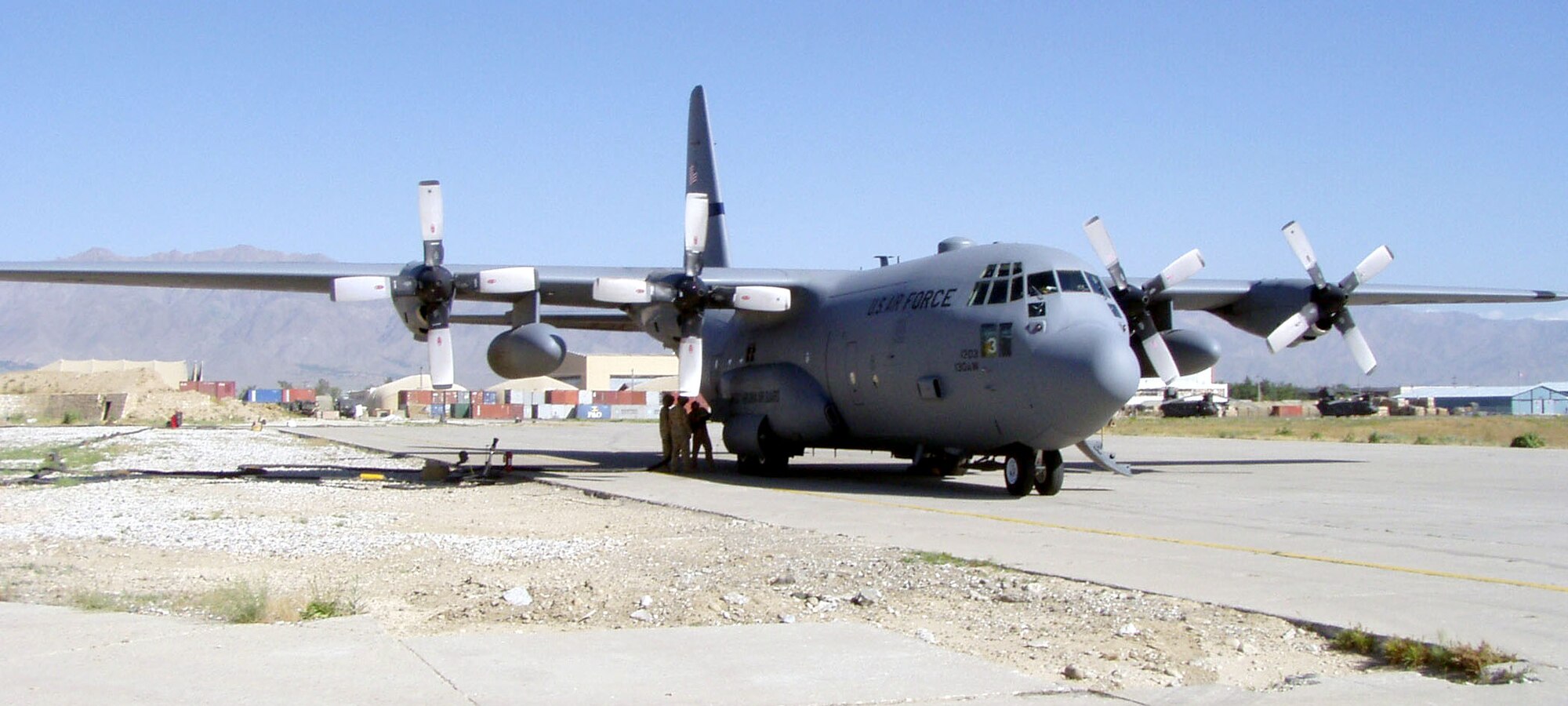 BAGRAM AIR BASE, Afghanistan (AFPN) -- A C-130 Hercules carrying passengers from the Regional Air Movement Control Center refuels here on its way to Kabul International Airport.  Center representatives went to Kabul to discuss airspace safety with aviation officials and civilian aircraft operators.  (U.S. Air Force photo by 2nd Lt. James Madeiros)
