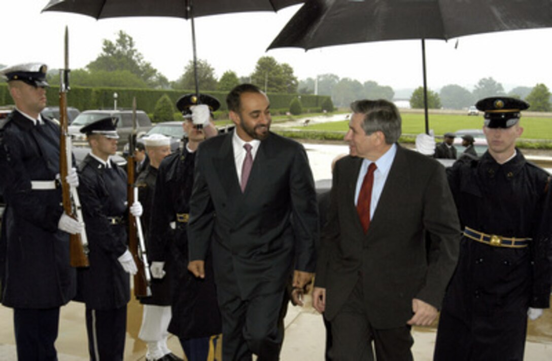 Deputy Secretary of Defense Paul Wolfowitz (right) escorts Lt. Gen. Muhammed bin Zayed al Nayhan, chief of staff of the armed forces of the United Arab Emirates, into the Pentagon on May 21, 2003. The two defense leaders will meet to discuss a range of bilateral and regional security issues. 