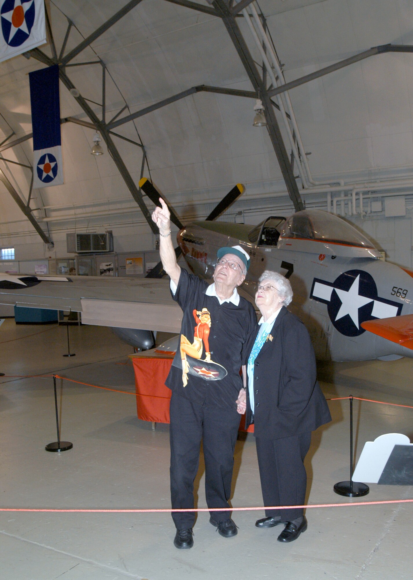 DOVER AIR FORCE BASE, Del. (AFPN) -- Drexel "Jack" Hite and his wife, Dot, admire vintage planes at the Air Mobility Command Museum during their recent visit here. This was the couple's first trip to Dover in 27 years. (U.S. Air Force photo by Airman 1st Class Deanna McClay)