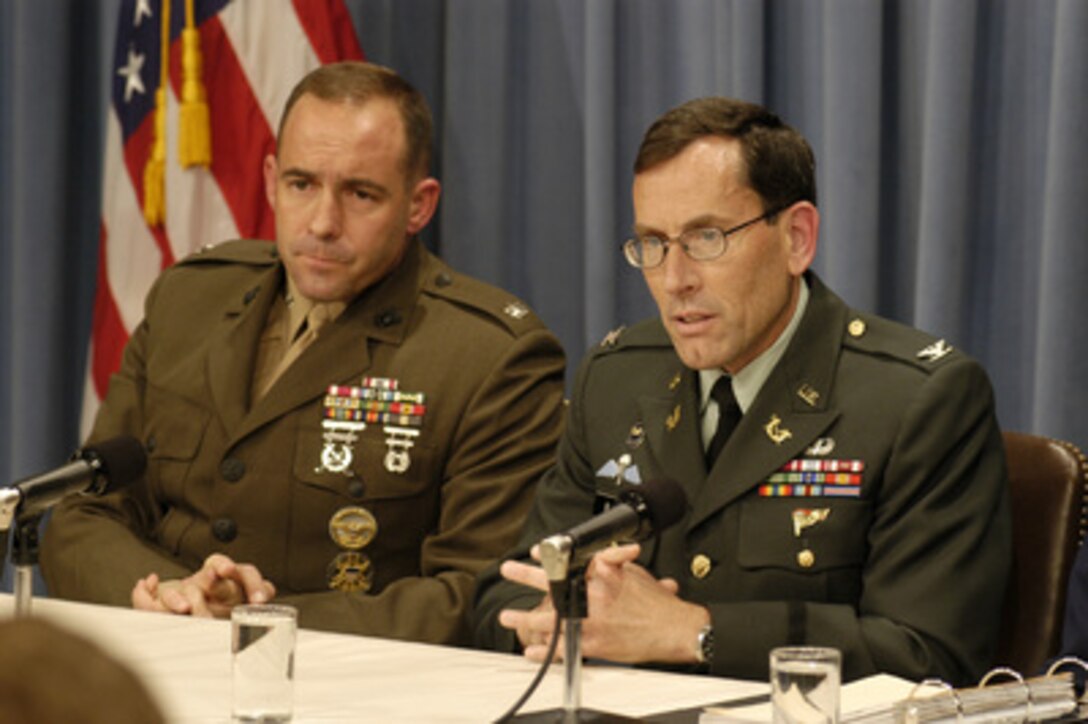 Marine Lt. Col. William Lietzau (left) and Army Col. Frederic Borch (right) participate in a press briefing in the Pentagon on May 22, 2003, dealing with military commissions. Lietzau, was the first military lawyer appointed to the position of acting chief prosecutor for military commissions. The Office of the General Counsel of the Department of Defense announced today that Col. Borch will be his replacement. In November 2001, President George W. Bush decided that enemy combatants taken into custody by the armed forces of the United States and charged as terrorists may be tried by military commissions. The President has not designated anyone stand trial by military commission, but it is deemed prudent to establish the framework for such a body should the need arise. 