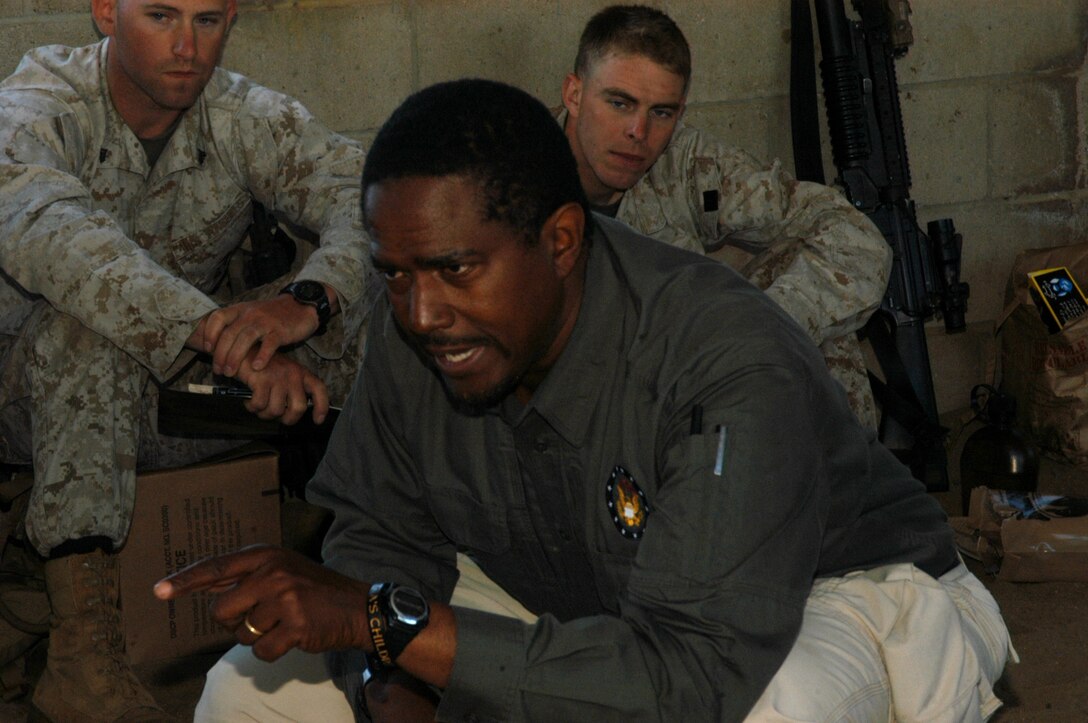 Kelvin Garvanne, a government contracted instructor with Veteran Government services, speaks to Marines from 1st Platoon, Company L, 3rd Battalion, 25th Marine Regiment about the Afghan culture May 24, 2010 at the 25 Area Combat Town, Camp Pendleton, Ca. The Marines learned about the Afghan way of life and languages in preparation for their upcoming deployment to Afghanistan later this year.