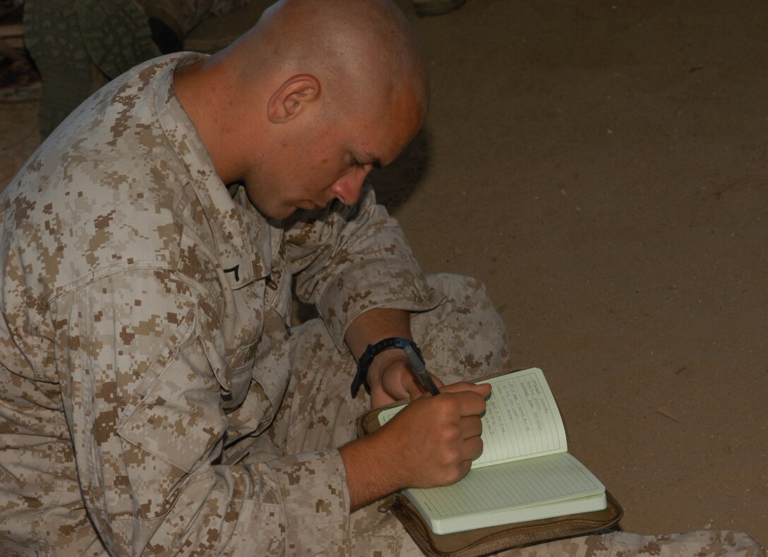 Pfc. Ryan Combs, a Cincinnati native from 1st Platoon, Company L, 3rd Battalion, 25th Marine Regiment, writes down words in the Pashto language May 24, 2010 at the 25 Area Combat Town, Camp Pendleton, Ca. The Marines learned Pashto, the language spoken by over 30 percent of the people in Afghanistan, where the Marines will be deploying to later this year.