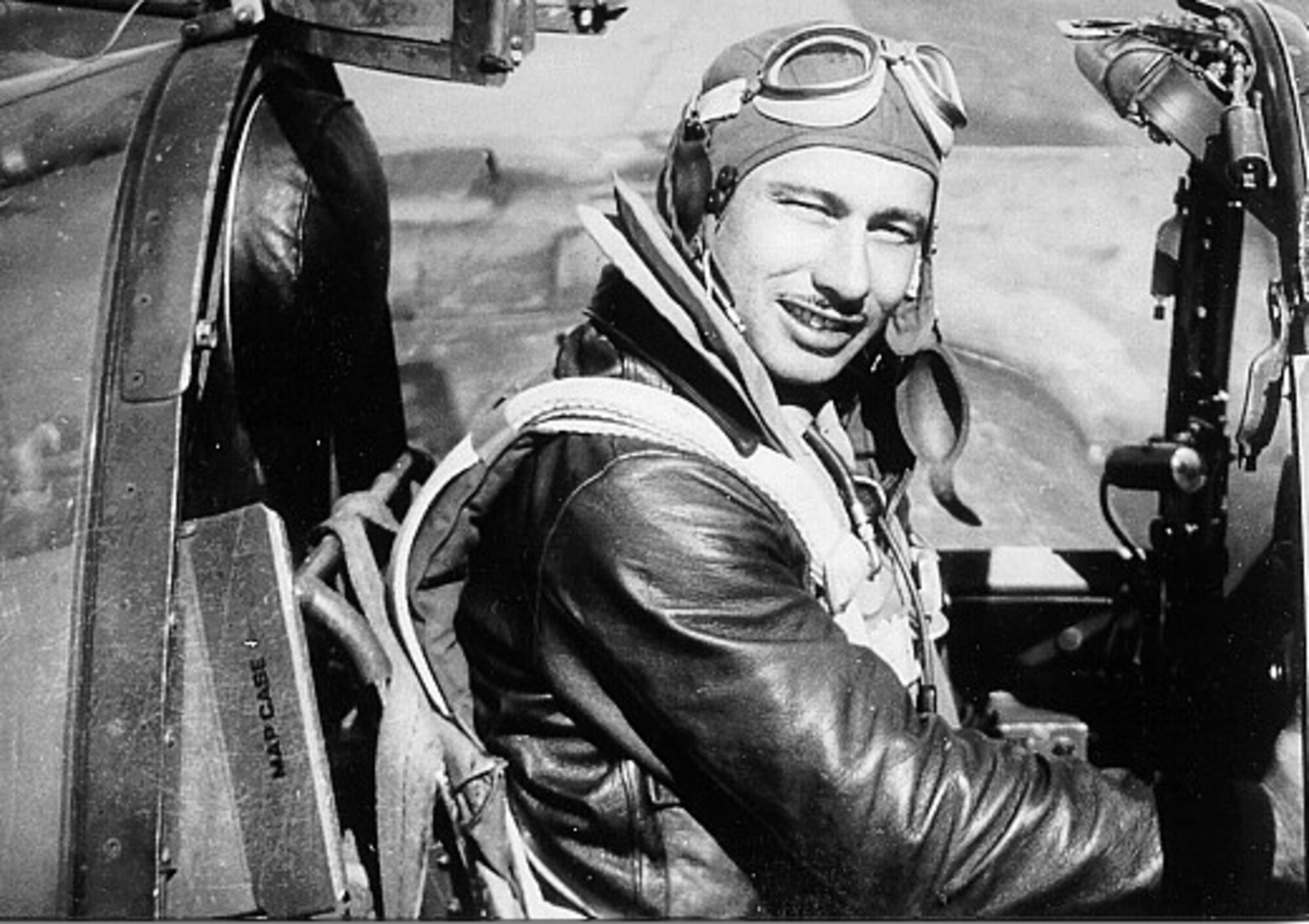 1940's -- First Lt. Carl Hoenshell poses in his P-38 Lightning during World War II.  He was declared killed in action in 1945, but his remains were not recovered until 2002.  His family buried him with full military honors in his hometown of Ossowa, Mich., on May 25.