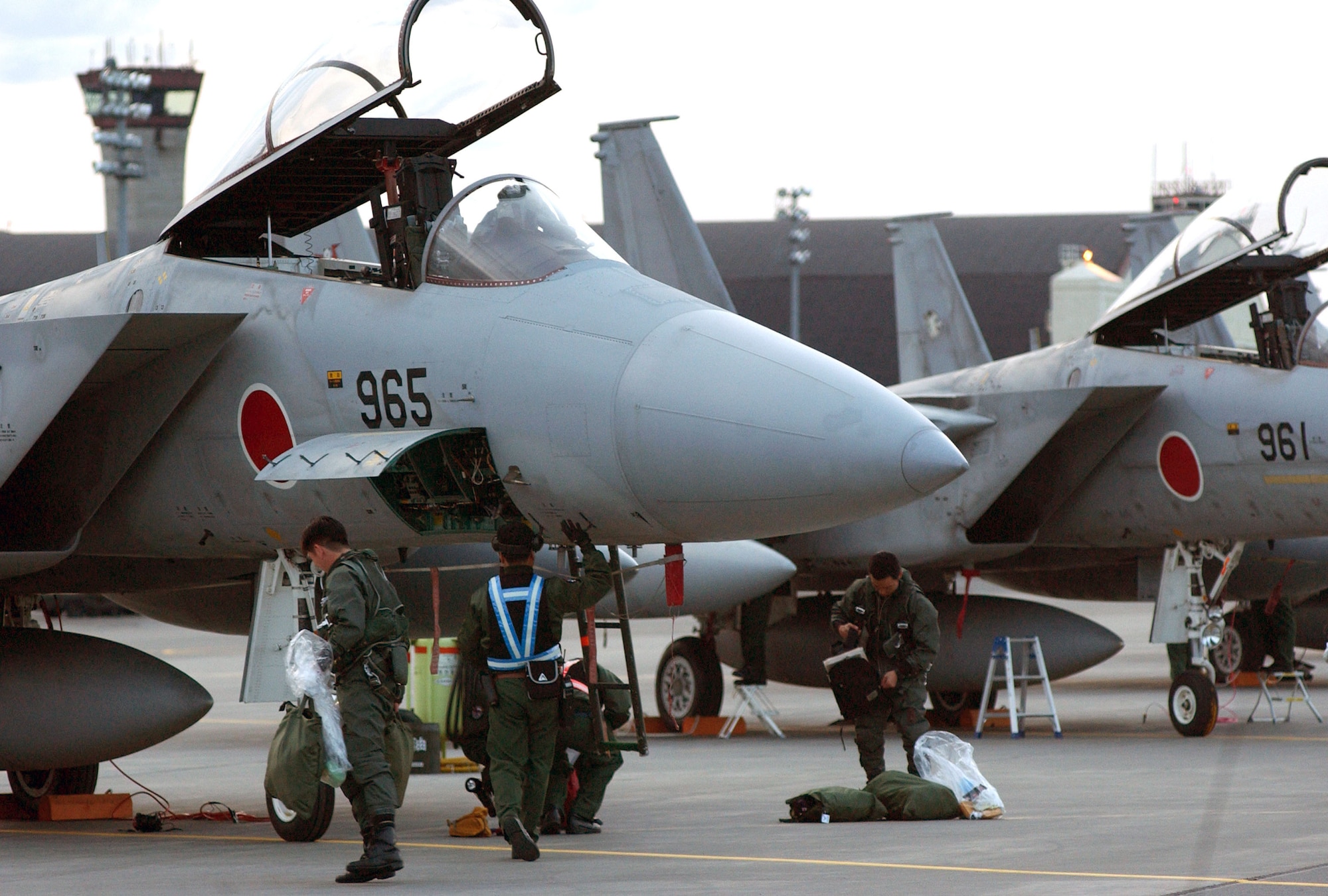 ELMENDORF AIR FORCE BASE, Alaska -- Japanese air self-defense force pilots and maintainers work on an F-15J fighter upon arriving here for Cooperative Cope Thunder.  Cope Thunder is a Pacific Air Forces-sponsored, air combat training exercise taking place June 5 to 20.  (U.S. Air Force photo by Tech. Sgt. Keith Brown)