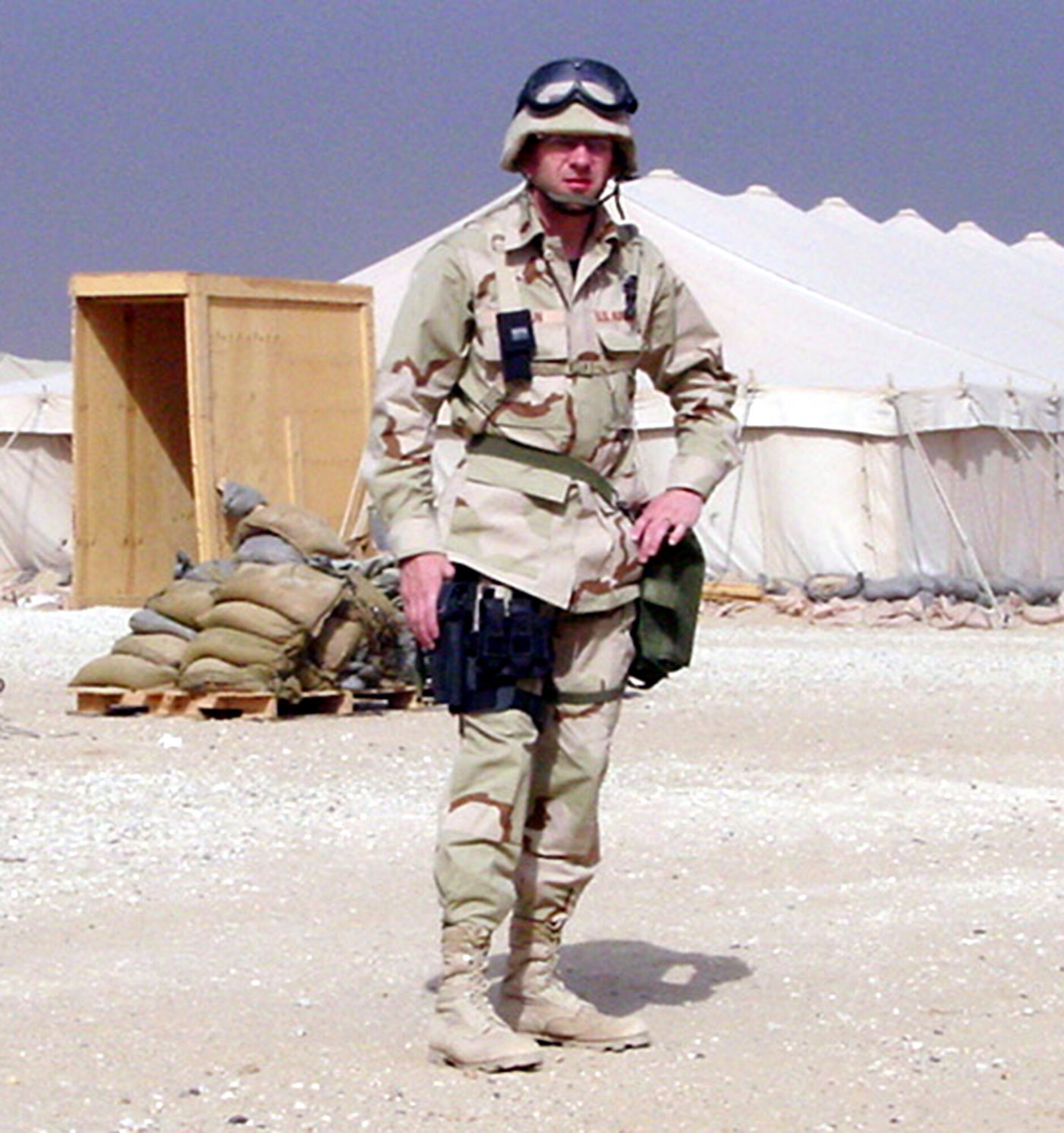 CAMP VIRGINIA, Kuwait -- Maj. Ken Sersun stands outside his tent here during Operation Iraqi Freedom. The major said he learned more about the Air Force mission during his first deployment than at any point in his 16-year career. (Courtesy photo)
