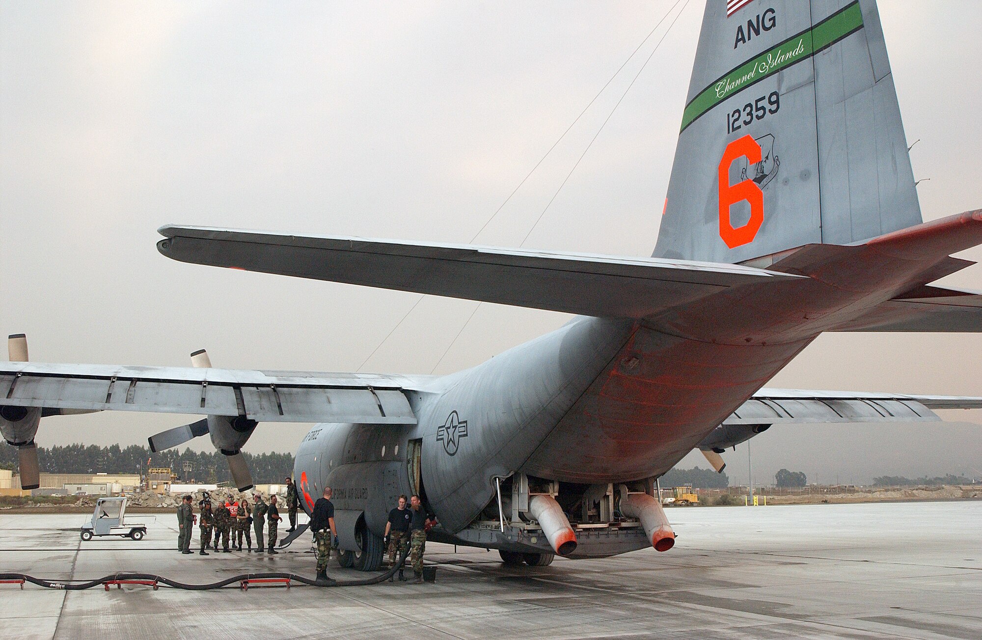 CHANNEL ISLANDS AIR NATIONAL GUARD STATION, Calif. -- A C-130 equipped with a modular airborne firefighting system helped fight wildfires in Southern California.  Pentagon officials released the deployed aircraft and airmen back to their home bases Nov. 2.  (U.S. Air Force photo by Senior Master Sgt. Dennis W. Goff)