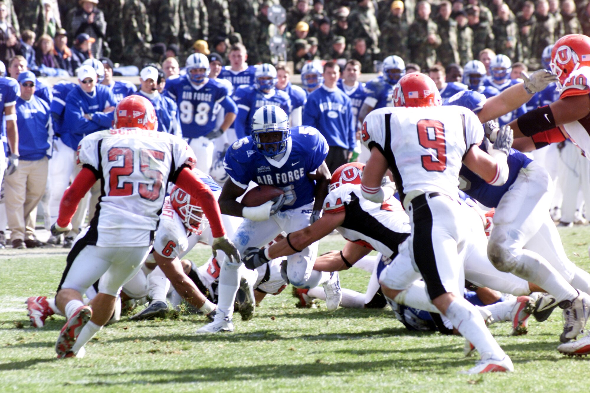U.S. AIR FORCE ACADEMY, Colo. -- Falcons halfback Anthony Butler looks for running room amongst the Utah defenders.  The junior carried 11 times for 59 yards and one touchdown during the Falcons' 45-43 triple-overtime loss to Utah.  (U.S. Air Force photo by John Van Winkle)