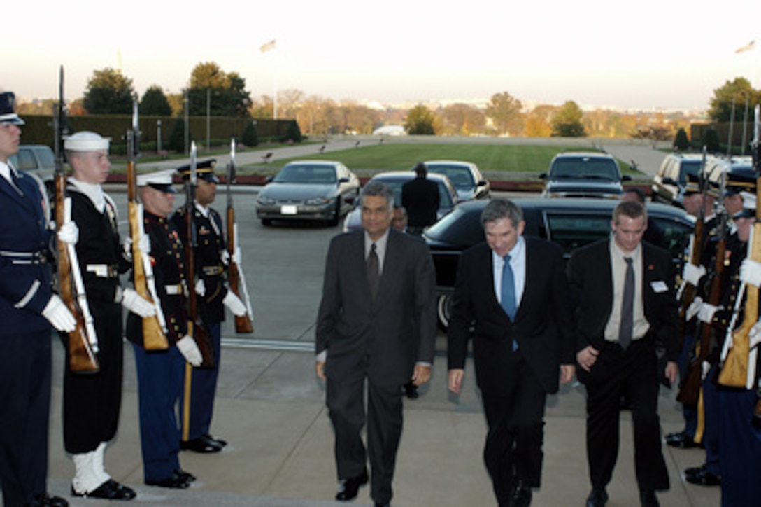 Deputy Secretary of Defense Paul Wolfowitz escorts Prime Minister Ranil Wickremesinghe of Sri Lanka (left) into the Pentagon on Nov. 3, 2003. The leaders are meeting to discuss defense issues of mutual interest. 