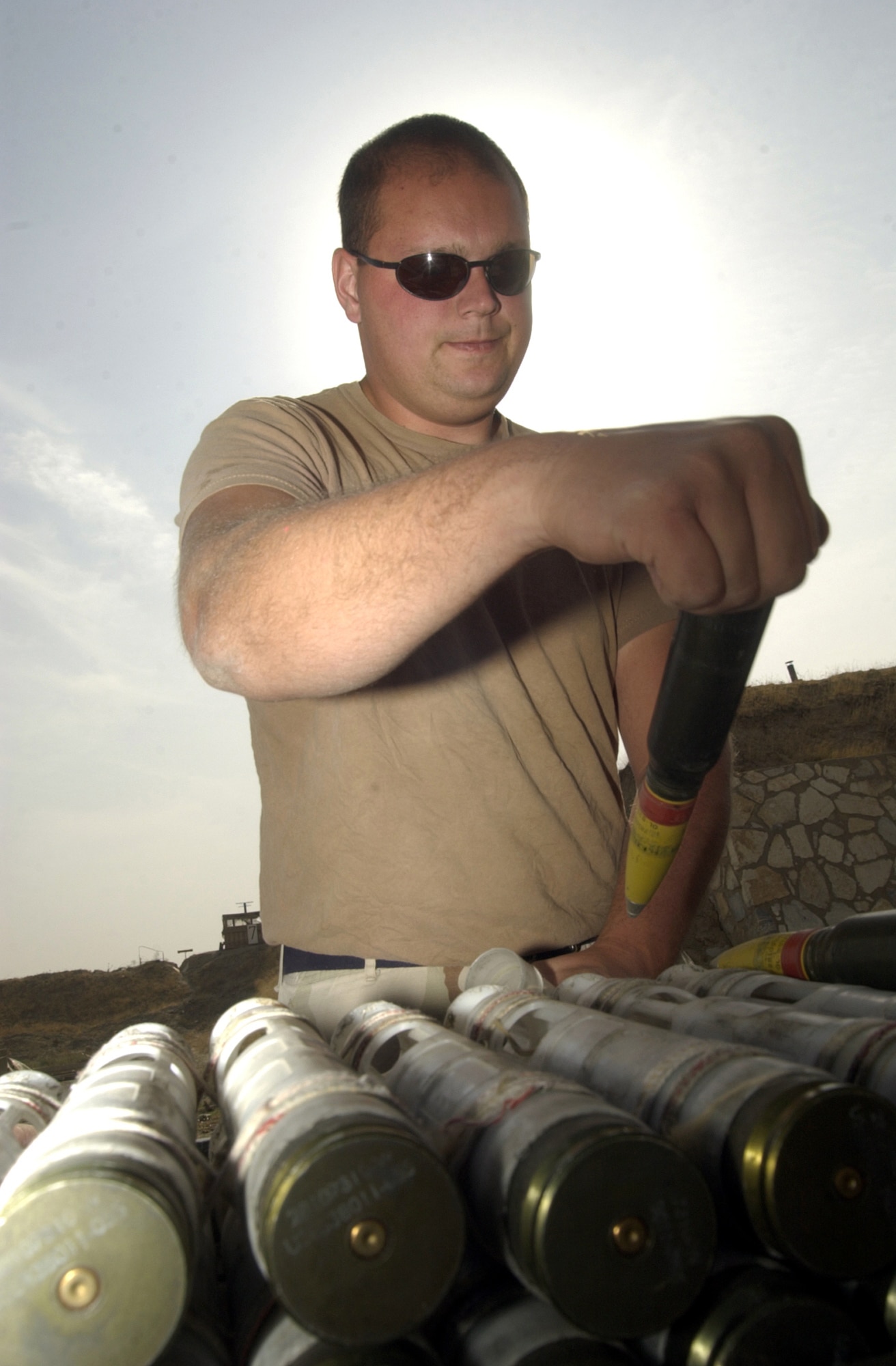 BAGRAM AIR BASE, Afghanistan -- Staff Sgt. Jerrad Oakes prepares to place a 30 mm ammunition round in a loading sleeve so it can be loaded on an A-10 Thunderbolt II for combat here.  Oakes is assigned to the 455th Expeditionary Operations Group and is deployed as part of Air and Space Expeditionary Force Blue from Spangdahlem Air Base, Germany.  Airmen with AEF Silver are replacing those with AEF Blue.  (U.S. Air Force photo by Staff Sgt. Russell Wicke)

