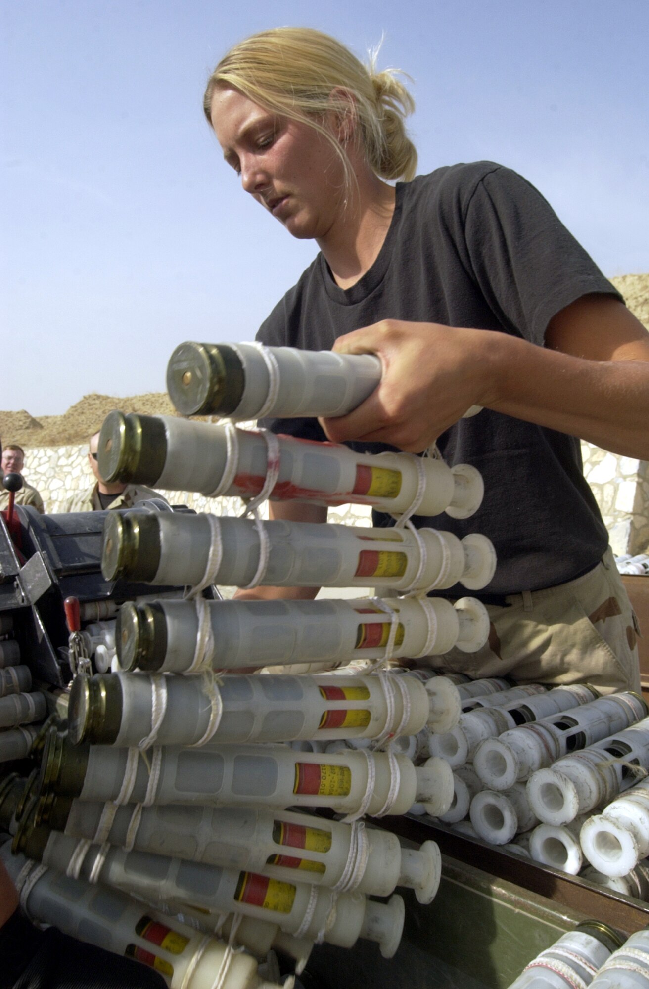 BAGRAM AIR BASE, Afghanistan -- Senior Airman Margot Hubbard prepares 30 mm ammunition rounds for processing and loading into an A-10 Thunderbolt II where they will be used in combat here.  Hubbard is assigned to the 455th Expeditionary Operations Group and is deployed as part of Air and Space Expeditionary Force Blue from Spangdahlem Air Base, Germany.  Airmen with AEF Silver are replacing those with AEF Blue.  (U.S. Air Force photo by Staff Sgt. Russell Wicke)

