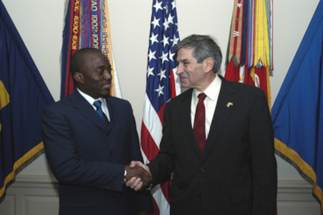 President Joseph Kabila of the Democratic Republic of the Congo meets with Deputy Secretary of Defense Paul Wolfowitz at the Pentagon on Nov. 6, 2003. The two leaders are meeting to discuss defense issues of mutual interest. 