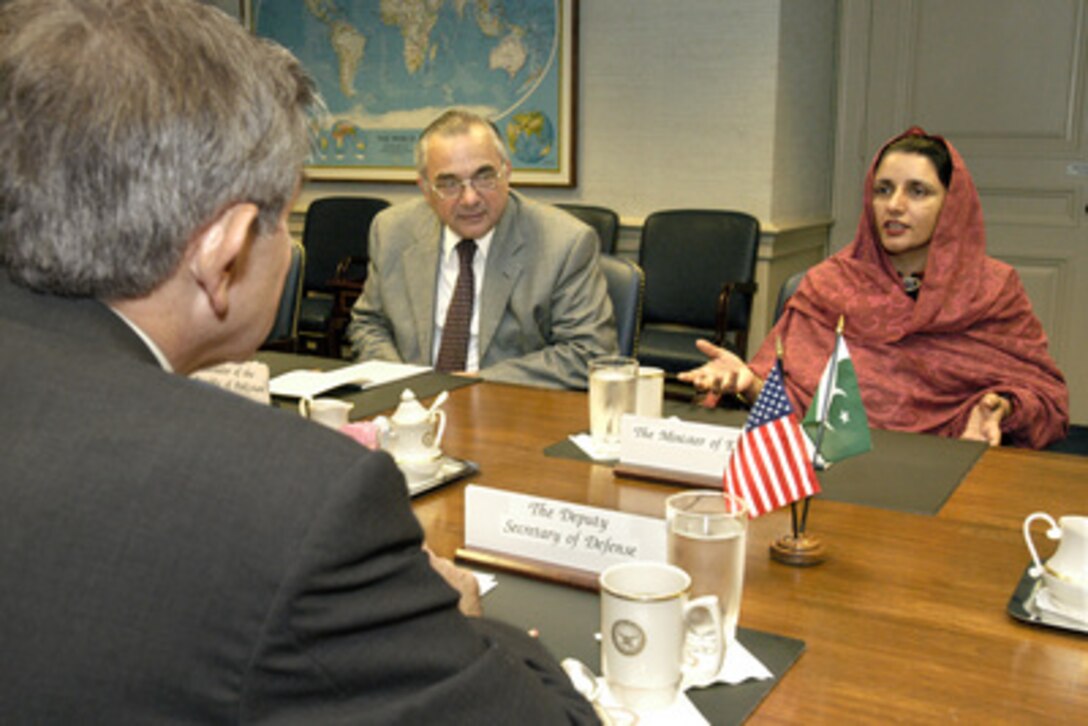 Pakistani Minister of Education Zubaida Jalal Khan (right) meets with Deputy Secretary of Defense Paul Wolfowitz (foreground) in the Pentagon on Nov. 6, 2003. Also participating in the talks is Pakistani Ambassador Ashraf Jehangir Qazi (center). 