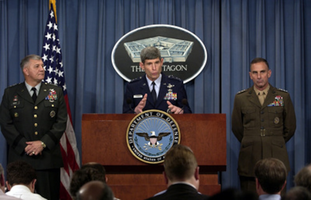 Director for Operations of the Joint Staff Lt. Gen. Norton Schwartz (center), U.S. Air Force, briefs reporters on the details of the plans for the rotation of forces in support of Operations Enduring Freedom and Iraqi Freedom during a Pentagon press briefing on Nov. 6, 2003. Schwartz, Army Deputy Chief of Staff G3 Lt. Gen. Richard Cody (left) and Marine Corps Deputy Commandant for Plans, Policy and Operations Lt. Gen. Jan C. Huly (right) gave reporters some of the specifics of the force rotation, which will include approximately 85,000 active duty and 43,000 reservists from all services. 