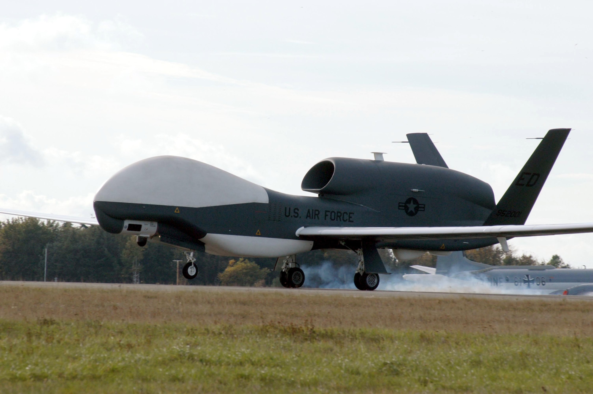 A Global Hawk unmanned aerial vehicle lands at Nordholz Air Base, Germany, after a demonstration sortie. The vehicle returned to Edwards Air Force Base, Calif., on Nov. 7, 2003.  (Northrup Grumman photo/Gene Yano)