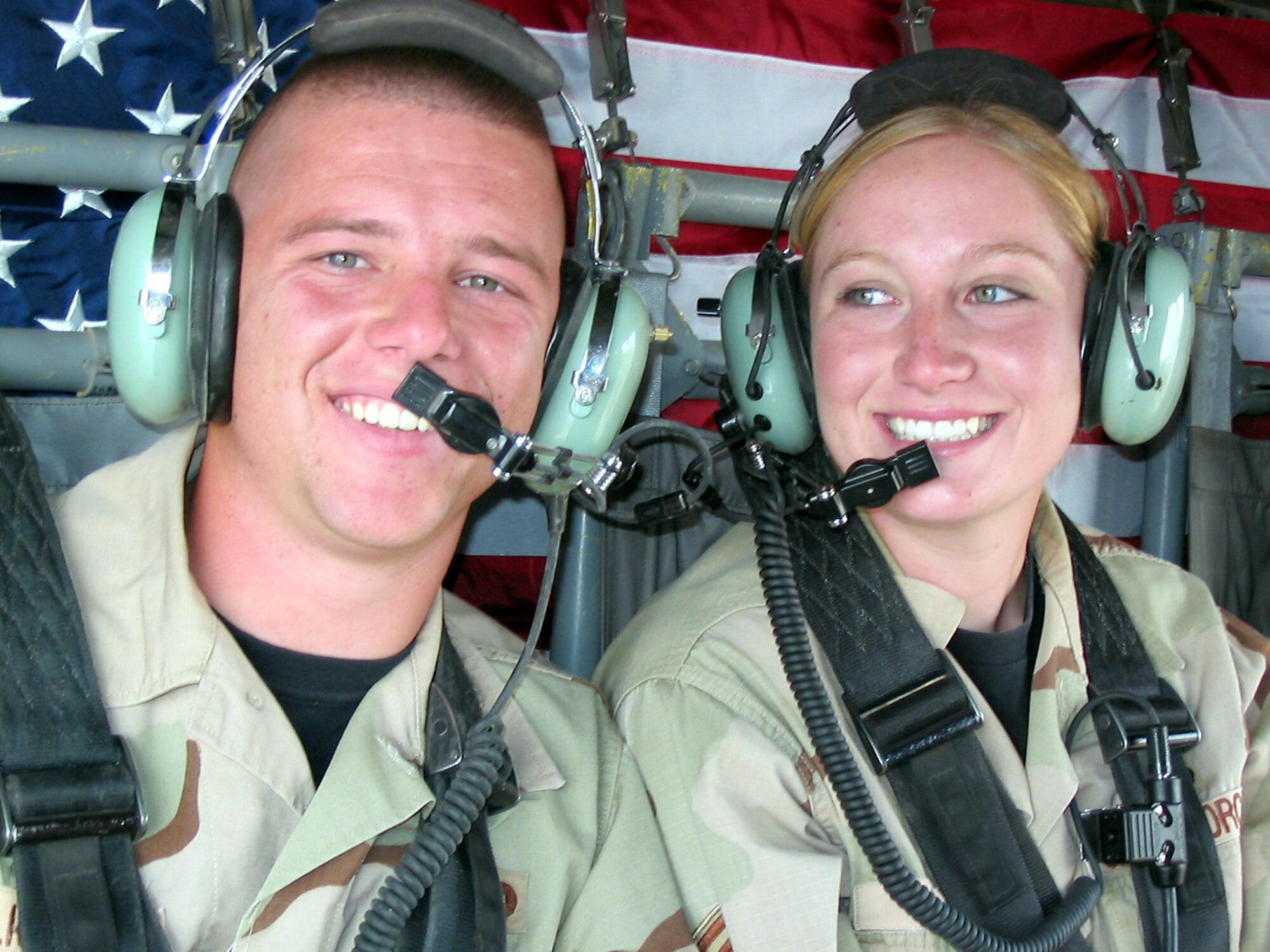 BALAD SOUTHEAST AIRFIELD, Iraq -- Airmen First Class Vernon Millican and Toni Chapman are all smiles as they get ready to take their wedding vows on board a UH-60 Black Hawk helicopter Nov. 6.  Both are deployed here from the 5th Security Forces Squadron at Minot Air Force Base, N.D.  (U.S. Air Force photo by Staff Sgt. Richard Watson)