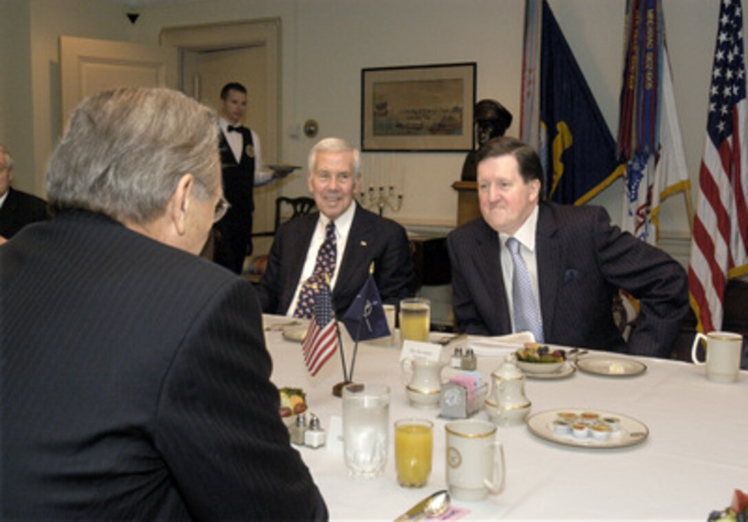 NATO Secretary General Lord George Robertson (right) is the guest of honor at a Pentagon breakfast hosted by Secretary of Defense Donald H. Rumsfeld (foreground) on Nov. 12, 2003. Robertson will soon be stepping down as secretary general of the North Atlantic Treaty Organization. Senator Richard Lugar (center) was among the several guests representing both houses of the U.S. Congress. Rumsfeld presented the Department of Defense Distinguished Public Service Award to Robertson in recognition of his exemplary leadership of the world's most important military alliance. 