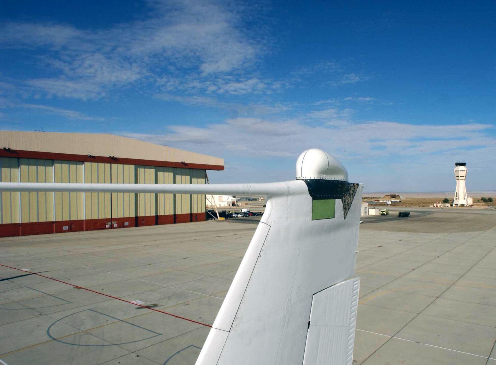 EDWARDS AIR FORCE BASE, Calif. -- A C-135C Speckled Trout began six months of flight testing on the new local-area-network system recently.  The antenna, located on the tail of the aircraft, is about the size a home television satellite dish.  (U.S. Air Force photo by George Villarino)