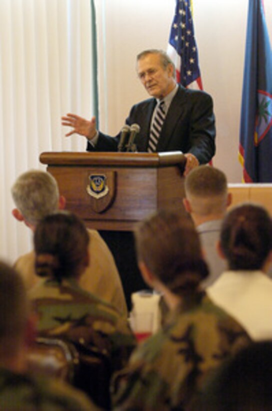 Secretary of Defense Donald H. Rumsfeld answers a question from the audience during a town hall meeting at Andersen Air Force Base, Guam, on Nov. 14, 2003. Rumsfeld is traveling to Guam, Japan and South Korea to meet with U.S. military forces and the local military and civilian leadership. 