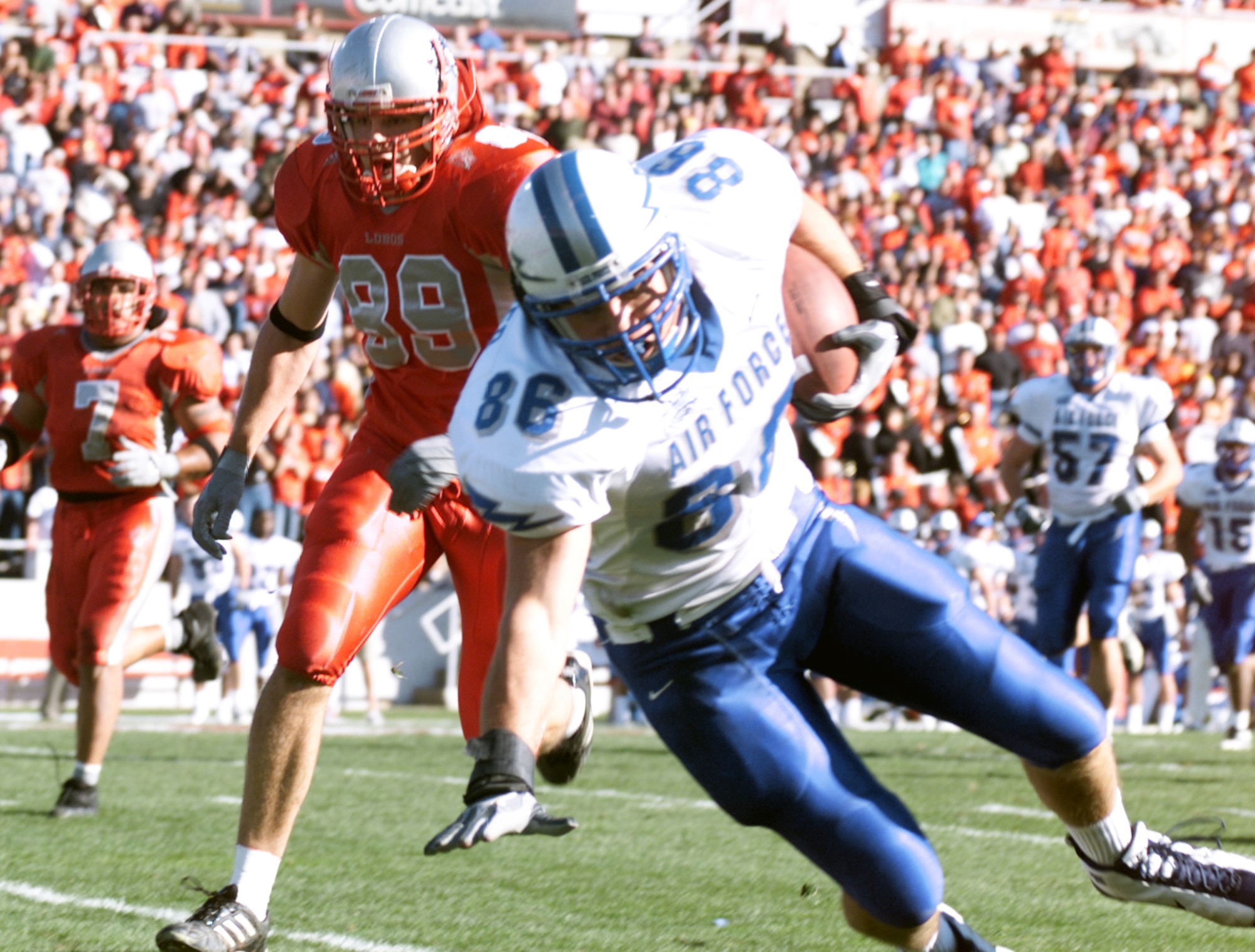 ALBUQUERQUE, N.M. -- Air Force tight end Adam Strecker tries to break his fall, after making an off-balance catch for a 17-yard gain.  The senior had four receptions for 55 yards during the Falcons' 24-12 loss to the University of New Mexico Lobos on Nov. 15.  (U.S. Air Force photo by John Van Winkle)