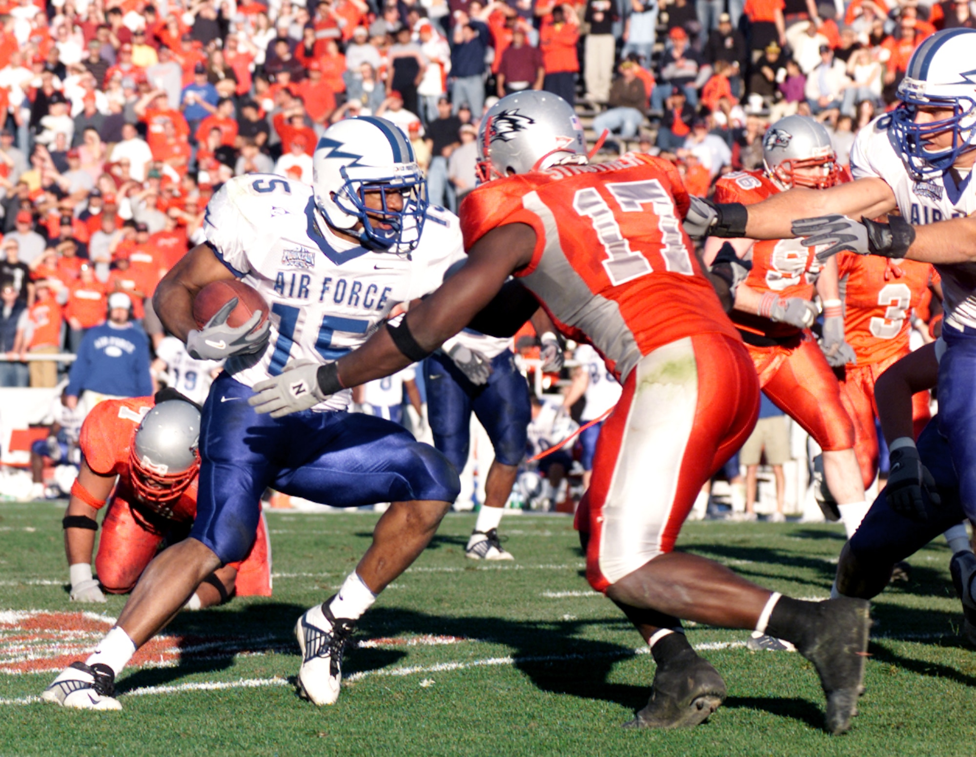 ALBUQUERQUE, N.M. -- Air Force halfback Darnell Stephens cuts upfield to avoid the grasp of New Mexico linebacker Billy Strother.  The junior rushed four times for 27 yards and the team's sole touchdown during Air Force's 24-12 loss to the University of New Mexico Lobos on Nov. 15.  (U.S. Air Force photo by John Van Winkle)