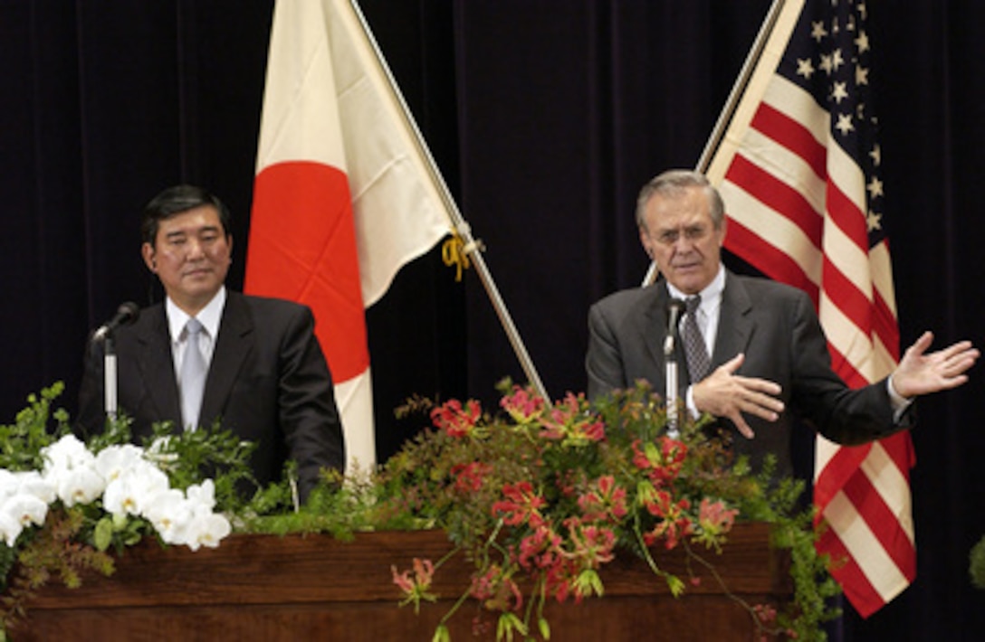 Secretary of Defense Donald H. Rumsfeld (right) and Minister of State for Defense Shigeru Ishiba speak to reporters during a joint press conference at the Japan Defense Agency in Tokyo on Nov. 15, 2003. Rumsfeld is traveling to Guam, Japan and South Korea to meet with U.S. military forces and the local military and civilian leadership. 