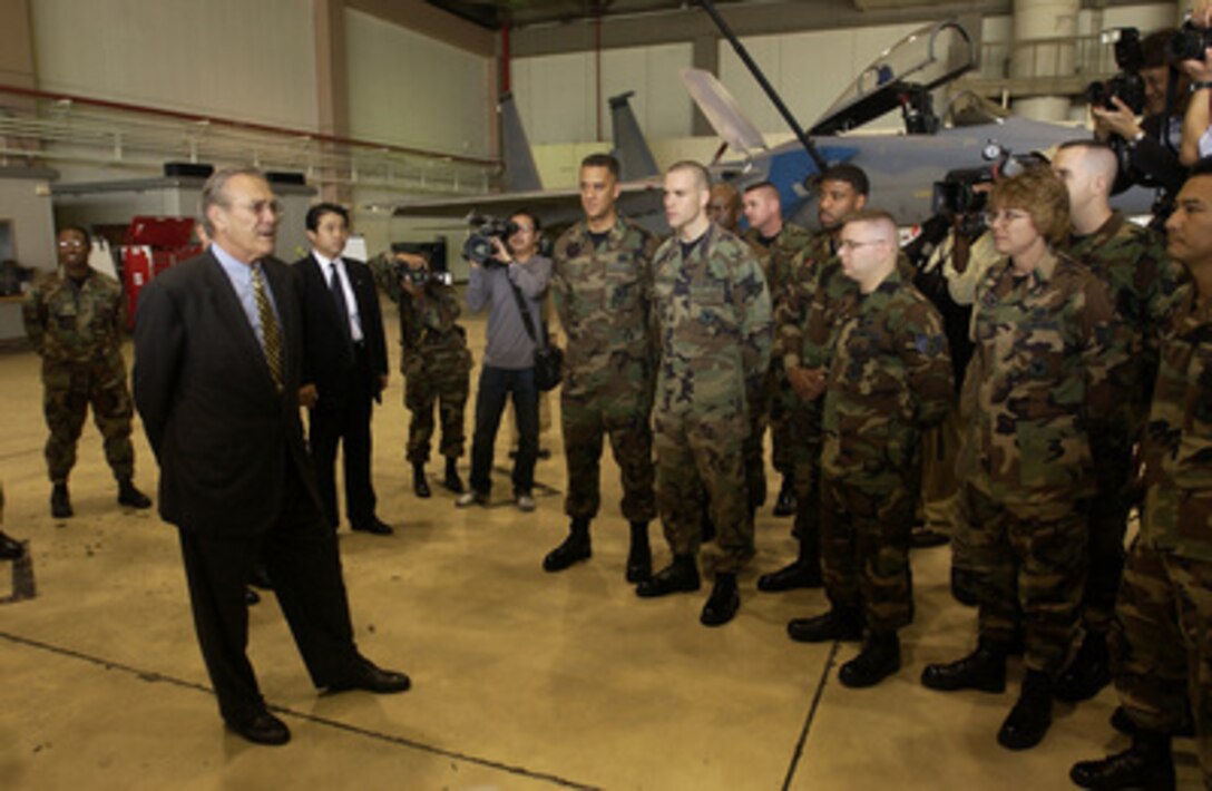 Secretary of Defense Donald H. Rumsfeld speaks informally to U.S. Air Force airmen at Kadena Air Base, Okinawa, on Nov. 16, 2003. Rumsfeld is traveling to Guam, Japan and South Korea to meet with U.S. military forces and the local military and civilian leadership. 