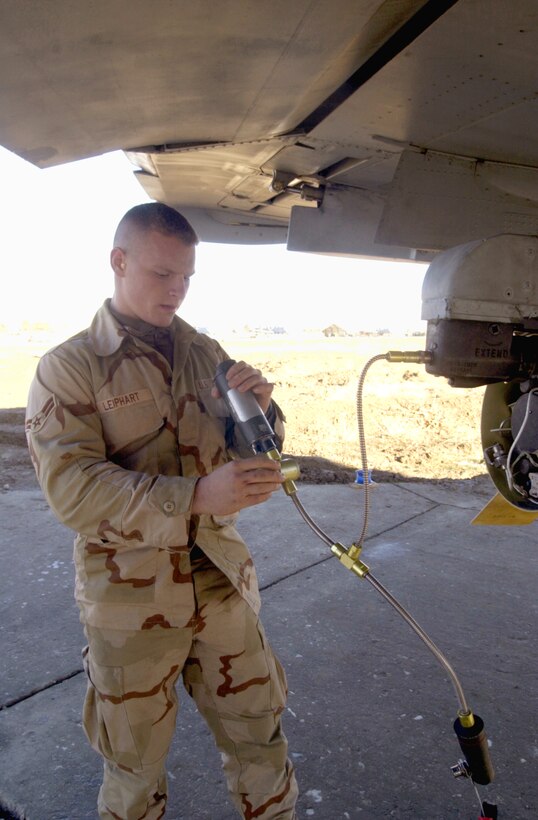 BAGRAM AIR BASE, Afghanistan -- Airman 1st Class Joseph Gumienny arms the weapons and inspects munitions to ensure an A-10 Thunderbolt II is ready for takeoff here Nov. 17.  Airmen of the 354th Expeditionary Fighter Squadron are providing close-air support to the Army's 10th Mountain Division as it pursues Taliban and al-Qaida forces during Operation Mountain Resolve.  Gumienny u=is deployed from Davis-Monthan Air Force Base, Ariz.  (U.S. Air Force photo by Tech. Sgt. Brian Davidson)