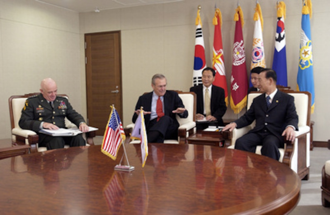 Secretary of Defense Donald H. Rumsfeld (center) speaks with South Korean Minister of National Defense Cho Yong-kil (right) at the National War Museum in Seoul, South Korea, on Nov. 17, 2003. Commander of U.S. Forces Korea Army Gen. Leon J. La Porte (left) accompanied Rumsfeld to discuss security issues of interest to both nations. Rumsfeld is traveling to Guam, Japan and South Korea to meet with U.S. military forces and the local military and civilian leadership. 