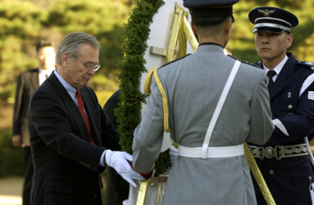 Secretary of Defense Donald H. Rumsfeld places a wreath at the National Cemetery in Seoul, South Korea, on Nov. 17, 2003. Rumsfeld met earlier with South Korean Minister of National Defense Cho Yong-kil at the National War Museum for the annual Security Consultative Meeting. Rumsfeld is traveling to Guam, Japan and South Korea to meet with U.S. military forces and the local military and civilian leadership. 