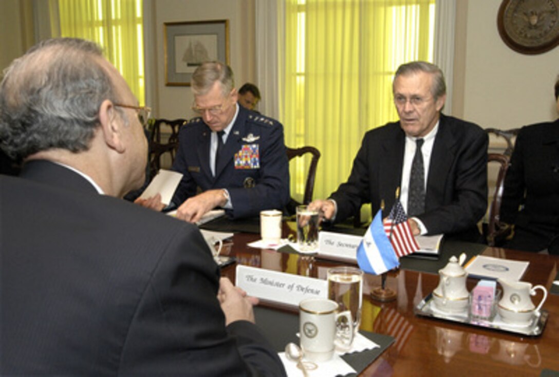 Secretary of Defense Donald H. Rumsfeld (right) hosts a Pentagon meeting with Nicaraguan Minister of Defense Jose Guerra (foreground) on Nov. 20, 2003. Rumsfeld and Guerra are meeting to discuss a broad range of regional and international security issues of interest to both nations. Also participating in the talks is Chairman of the Joint Chiefs of Staff Gen. Richard B. Myers (center), U.S. Air Force. 