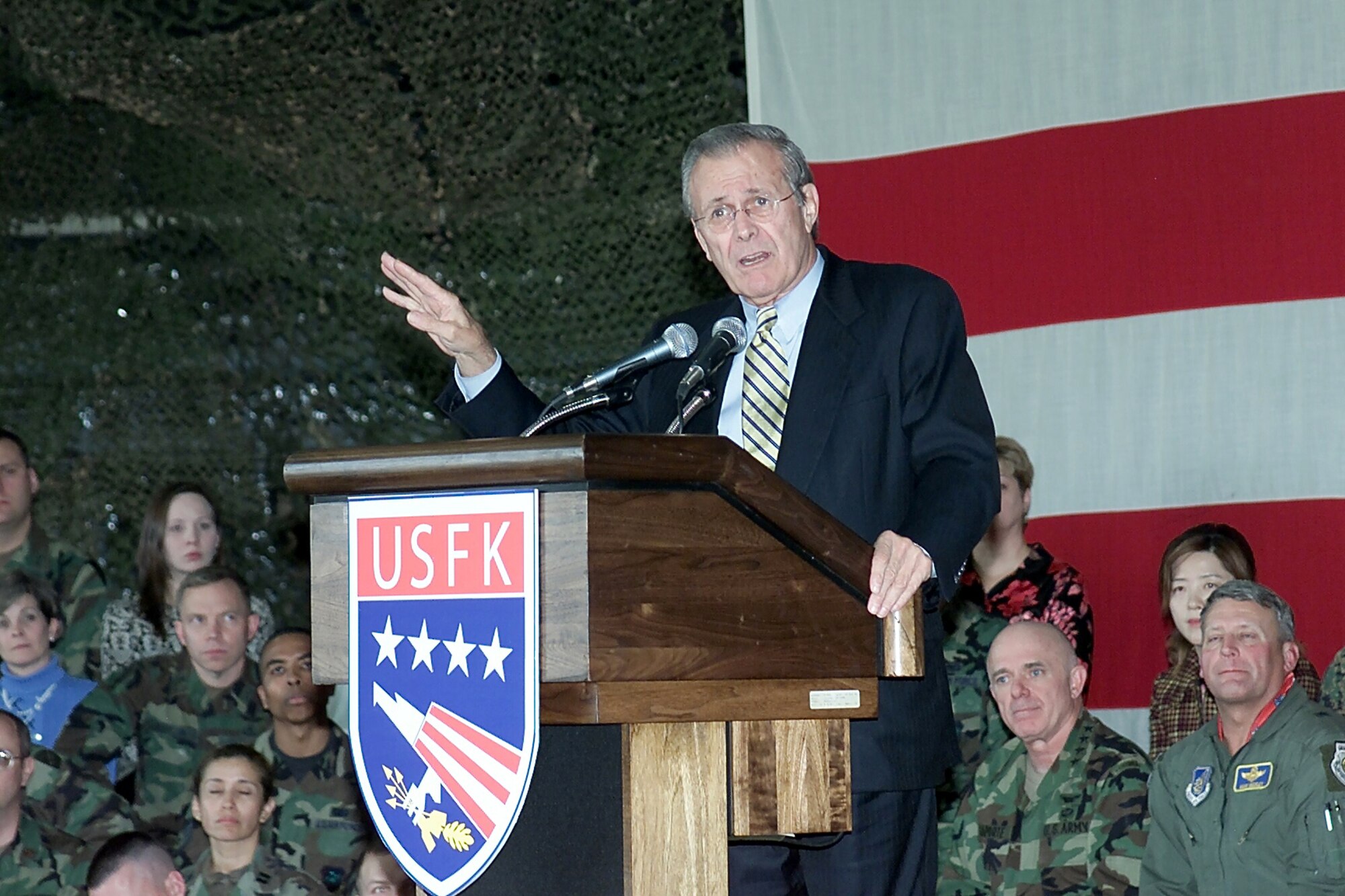 OSAN AIR BASE, South Korea -- Secretary of Defense Donald H. Rumsfeld speaks with nearly 1,000 airmen, soldiers, sailors, Marines and family members here during a town hall meeting Nov. 18.  (U.S. Air Force photo by Airman 1st Class Jessica DePierri)
