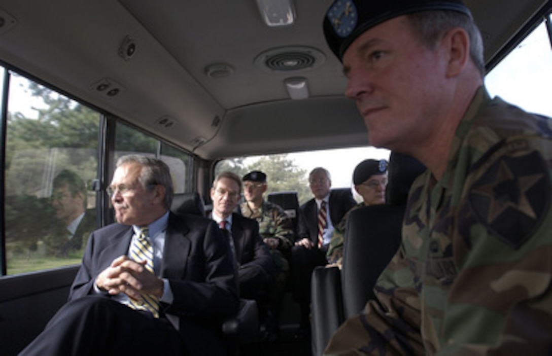Secretary of Defense Donald H. Rumsfeld tours Camp Casey, the headquarters of the 2nd U.S. Infantry Division, at Dongducheon, South Korea, on Nov. 18, 2003. Rumsfeld is traveling to Guam, Japan, and South Korea to meet with U.S. military forces and the local military and civilian leadership. 