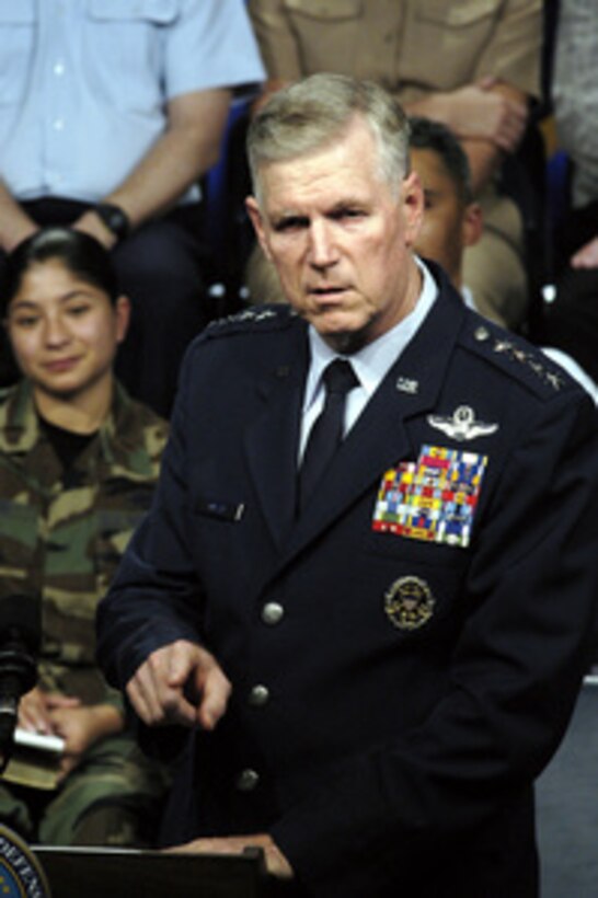 Chairman of the Joint Chiefs of Staff Gen. Richard B. Myers, USAF, explains a policy in response to a question from the audience during a Pentagon town hall meeting on Nov. 21, 2003. Myers and Secretary of Defense Donald H. Rumsfeld received a myriad of questions from military and Department of Defense civilians. 