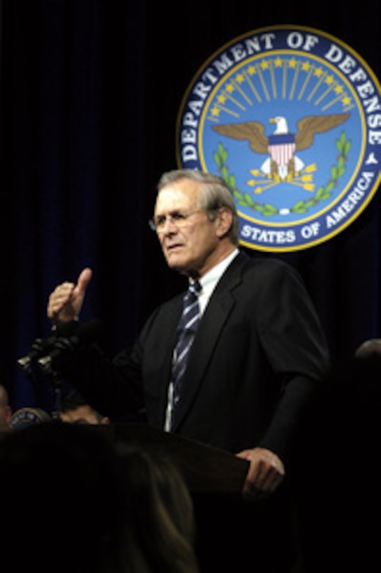 Secretary of Defense Donald H. Rumsfeld answers a question from the audience during a Pentagon town hall meeting on Nov. 21, 2003. 