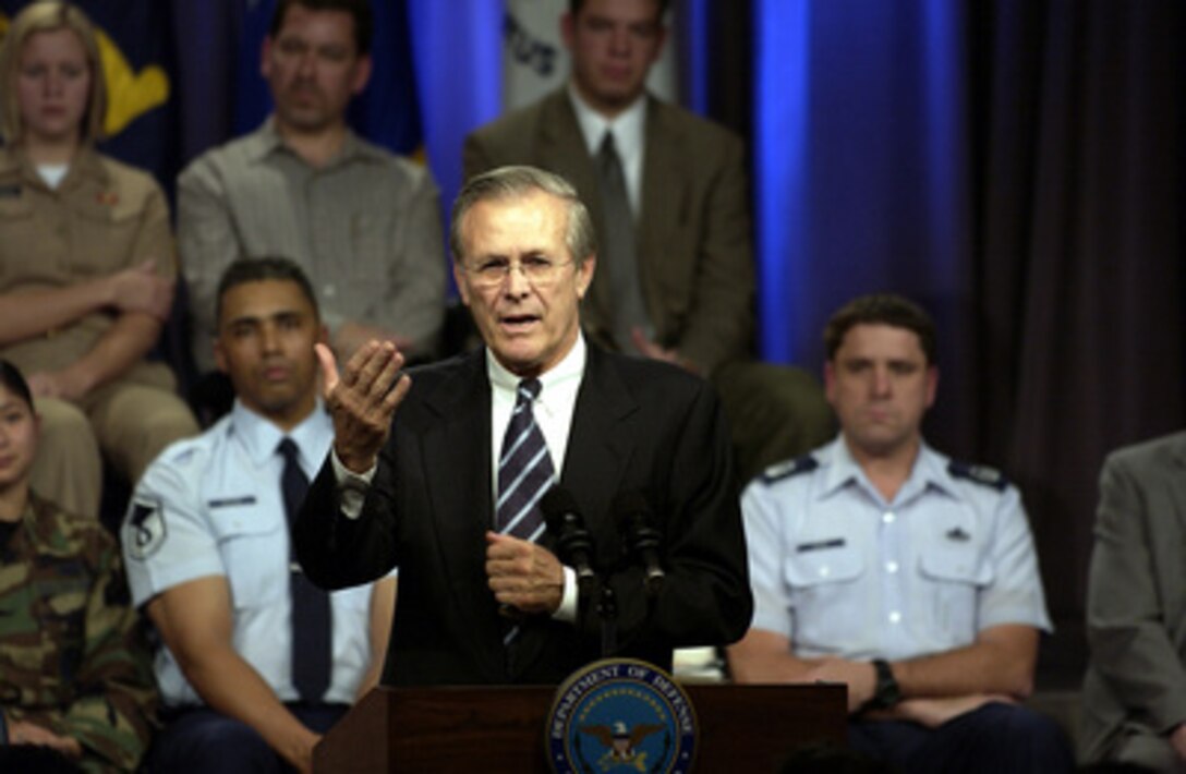 Secretary of Defense Donald H. Rumsfeld answers a question from the audience at a town hall meeting in the Pentagon auditorium on Nov. 21, 2003. Rumsfeld and Chairman of the Joint Chiefs of Staff Gen. Richard B. Myers, U.S. Air Force, delivered opening remarks then fielded questions from military and civilian Pentagon employees. The forum allows people in the Pentagon to direct their questions to the leadership of the Defense Department. 
