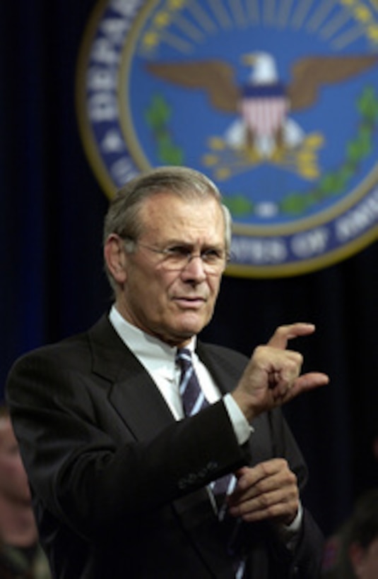 Secretary of Defense Donald H. Rumsfeld explains a policy in response to a question from the audience at a town hall meeting in the Pentagon auditorium on Nov. 21, 2003. Rumsfeld and Chairman of the Joint Chiefs of Staff Gen. Richard B. Myers, U.S. Air Force, delivered opening remarks then fielded questions from military and civilian Pentagon employees. The forum allows people in the Pentagon to direct their questions to the leadership of the Defense Department. 