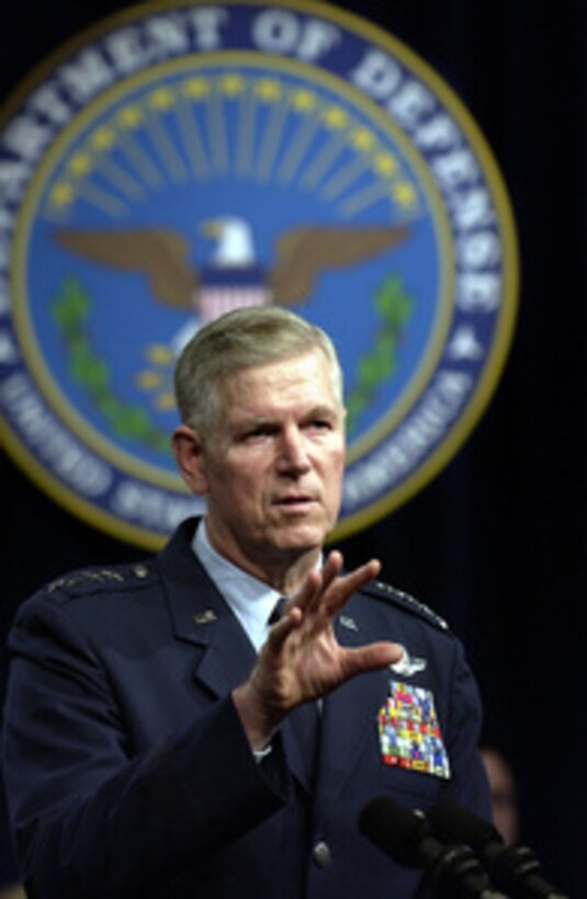 Chairman of the Joint Chiefs of Staff Gen. Richard B. Myers, U.S. Air Force, answers a question from a service member at a town hall meeting in the Pentagon auditorium on Nov. 21, 2003. Myers and Secretary of Defense Donald H. Rumsfeld delivered opening remarks then fielded questions from military and civilian Pentagon employees. The forum allows people in the Pentagon to direct their questions to the leadership of the Defense Department. 
