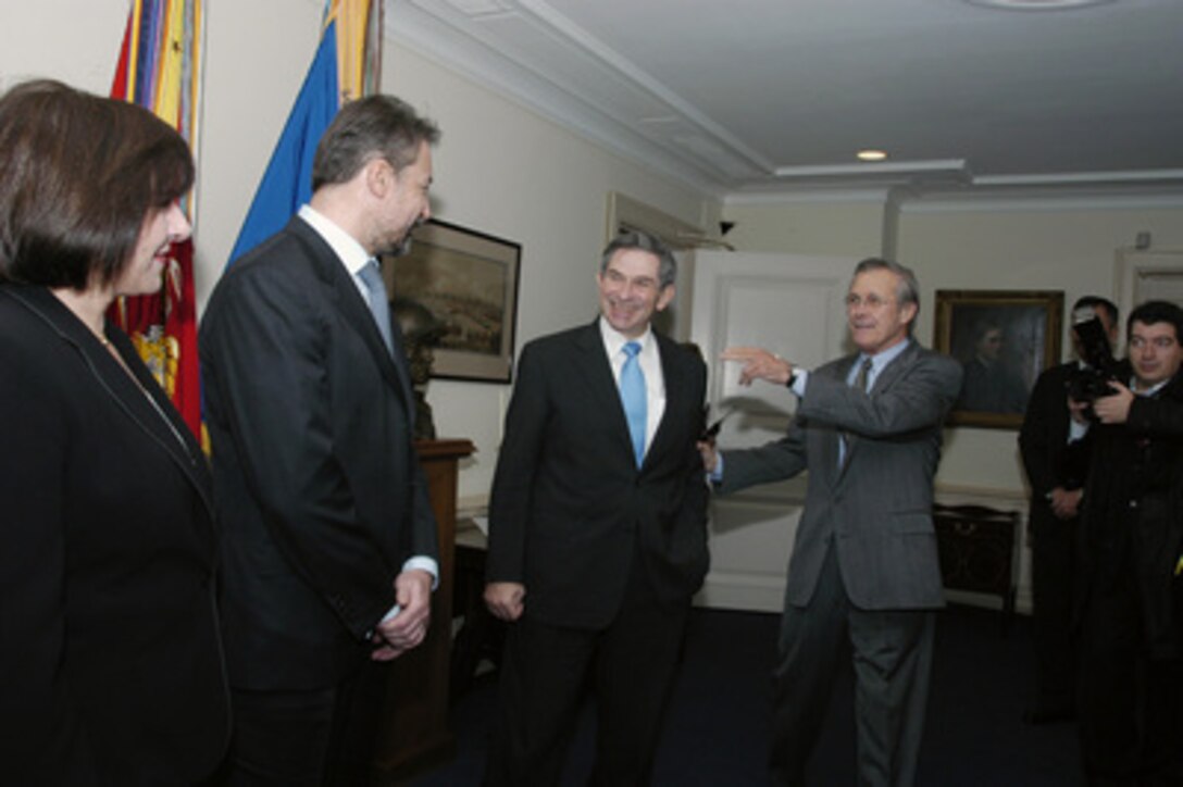 Secretary of Defense Donald H. Rumsfeld (right) introduces Deputy Secretary of Defense Paul Wolfowitz (center) to Prime Minister Branko Crvenkovski (second from left) of the Former Yugoslav Republic of Macedonia on Nov. 25, 2003. Crvenkovski is accompanied by Minister of Foreign Affairs Ilena Mitreva (left). The leaders are meeting in the Pentagon to discuss defense issues of mutual interest. 